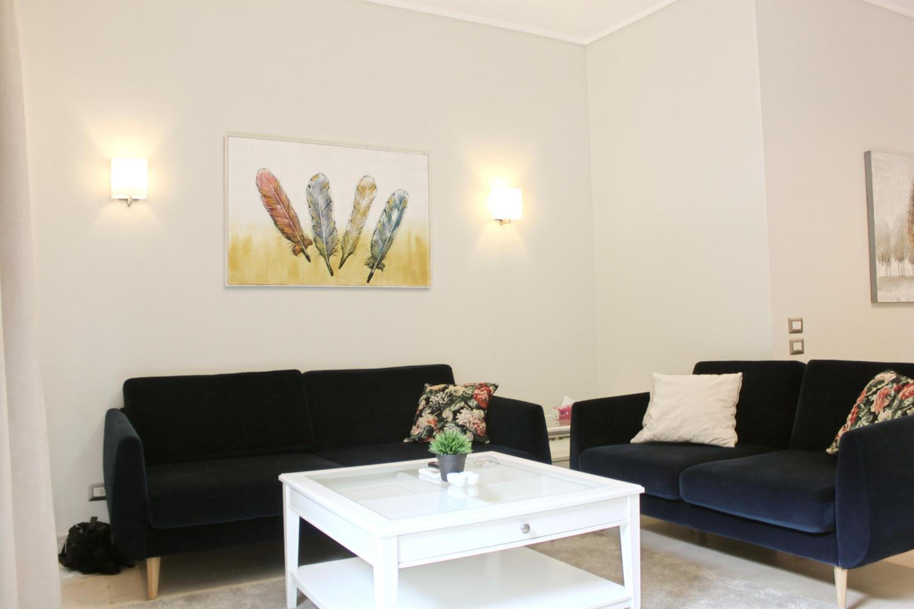 Private Garden 1BR Apt in Palm Hills AUC New Cairo