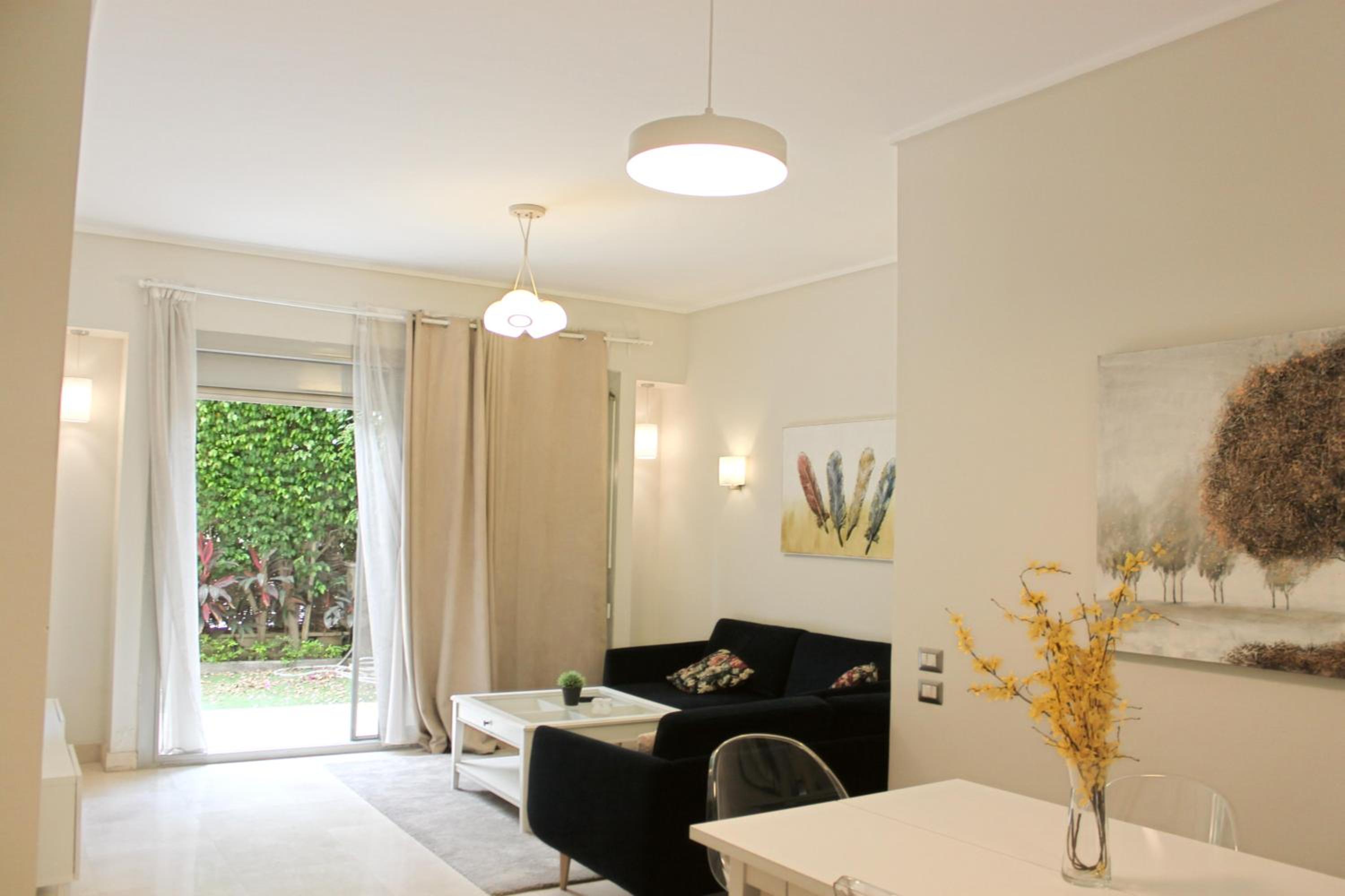 Private Garden 1BR Apt in Palm Hills AUC New Cairo