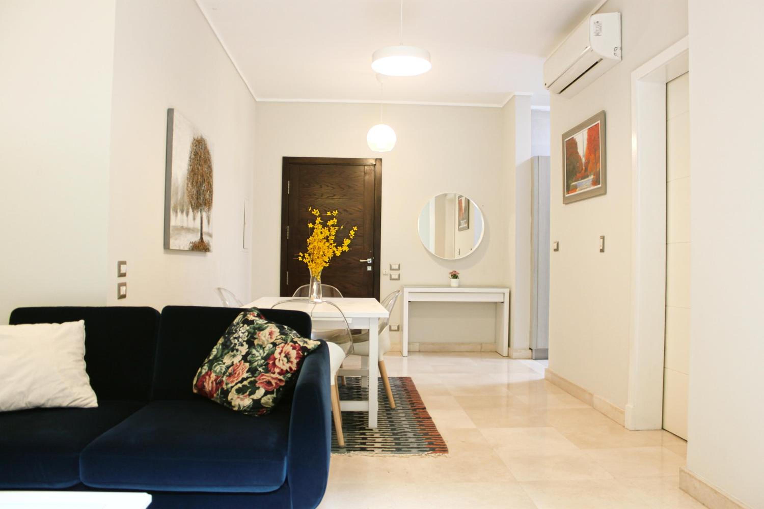 Private Garden 1BR Apt in Palm Hills AUC New Cairo