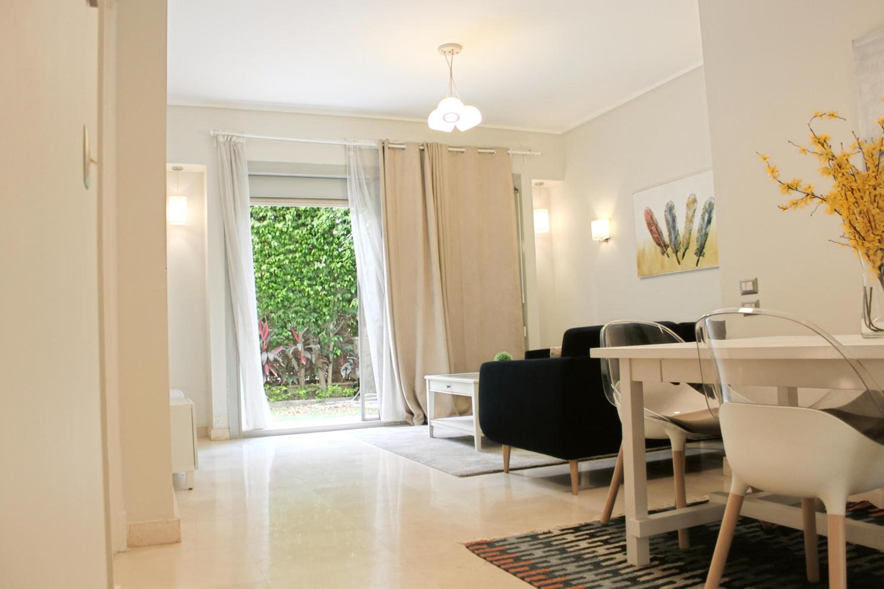 Private Garden 1BR Apt in Palm Hills AUC New Cairo
