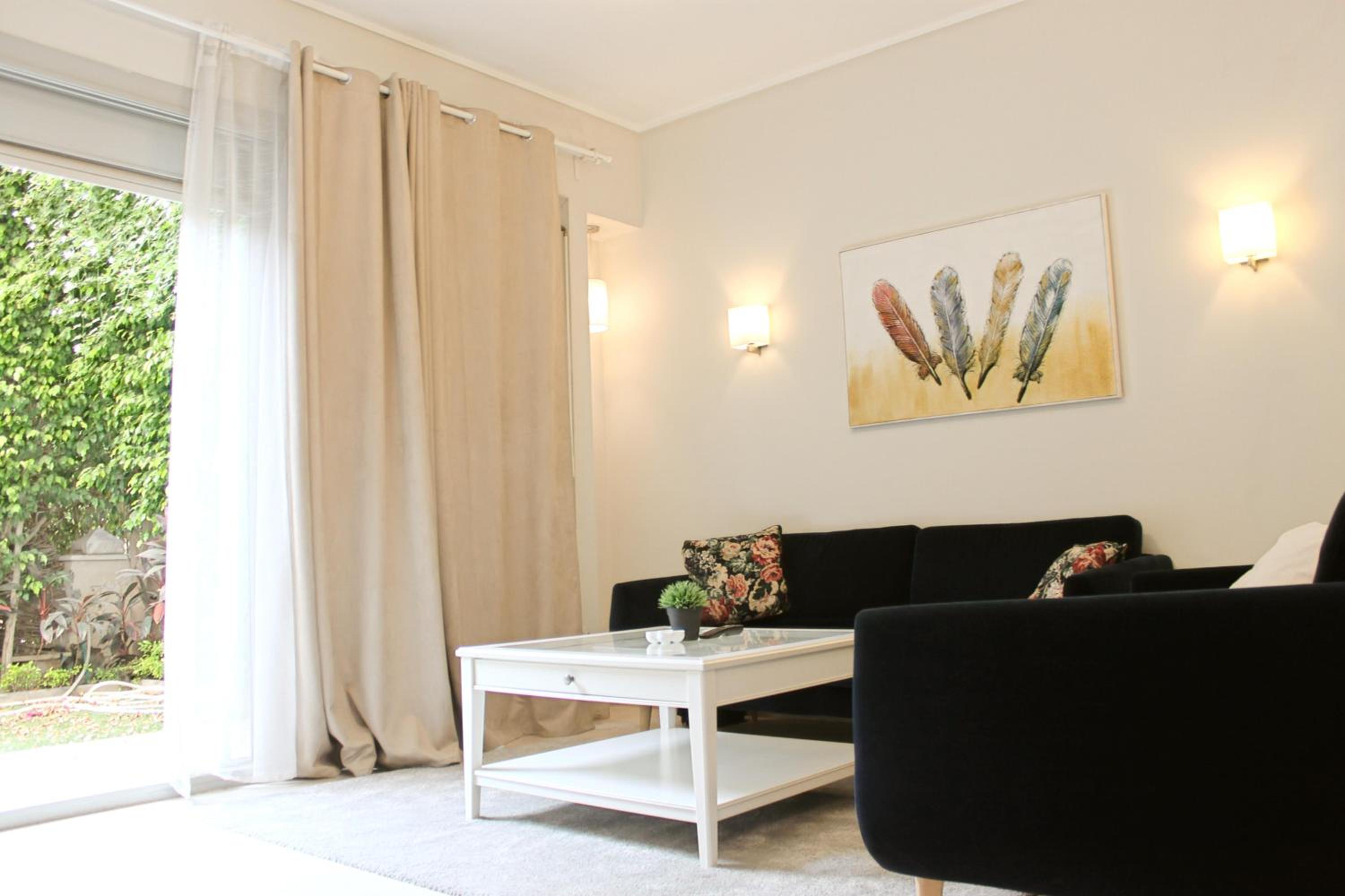 Private Garden 1BR Apt in Palm Hills AUC New Cairo