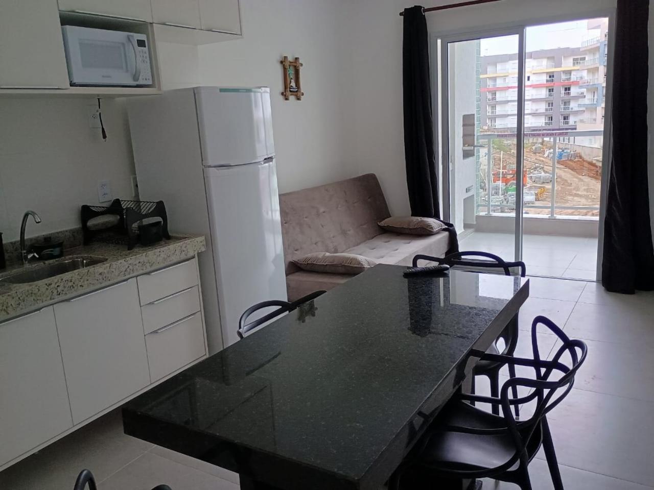 Apartamento 29 aconchegante de 1 quarto na PRAIA GRANDE, recém construido