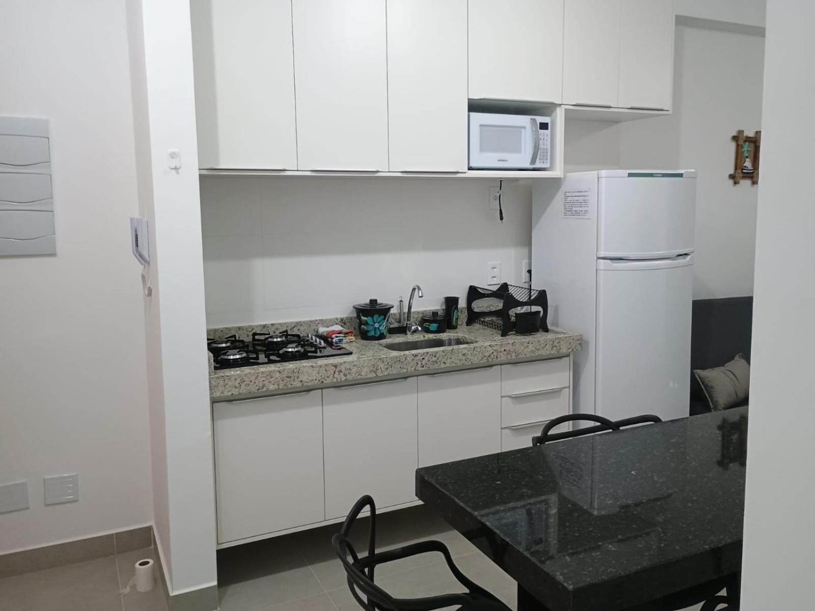 Apartamento 29 aconchegante de 1 quarto na PRAIA GRANDE, recém construido
