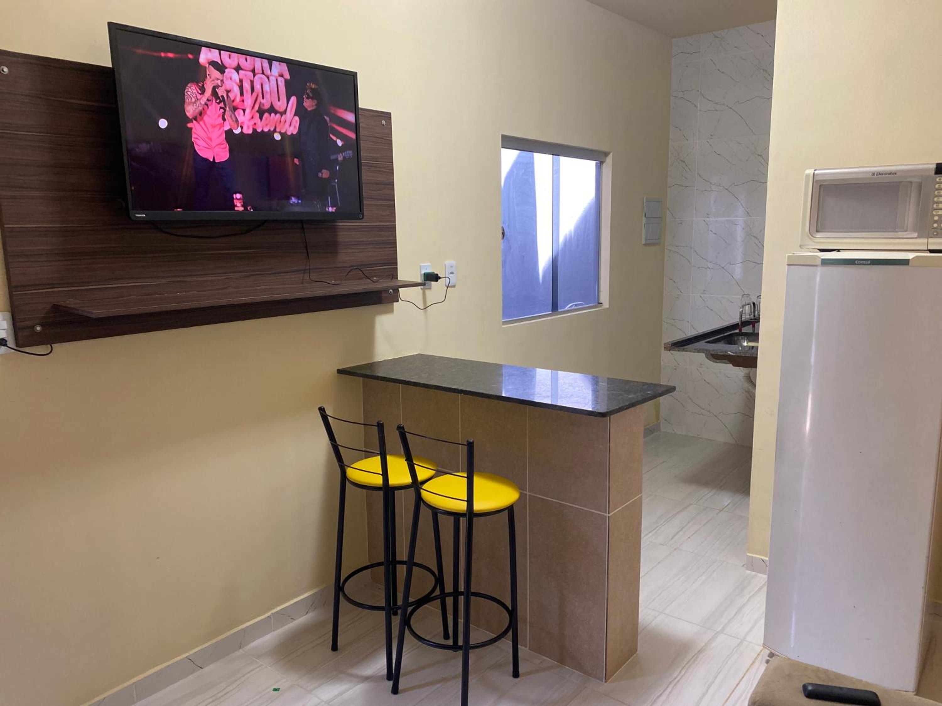 Flats com ar condicionado, garagem e internet