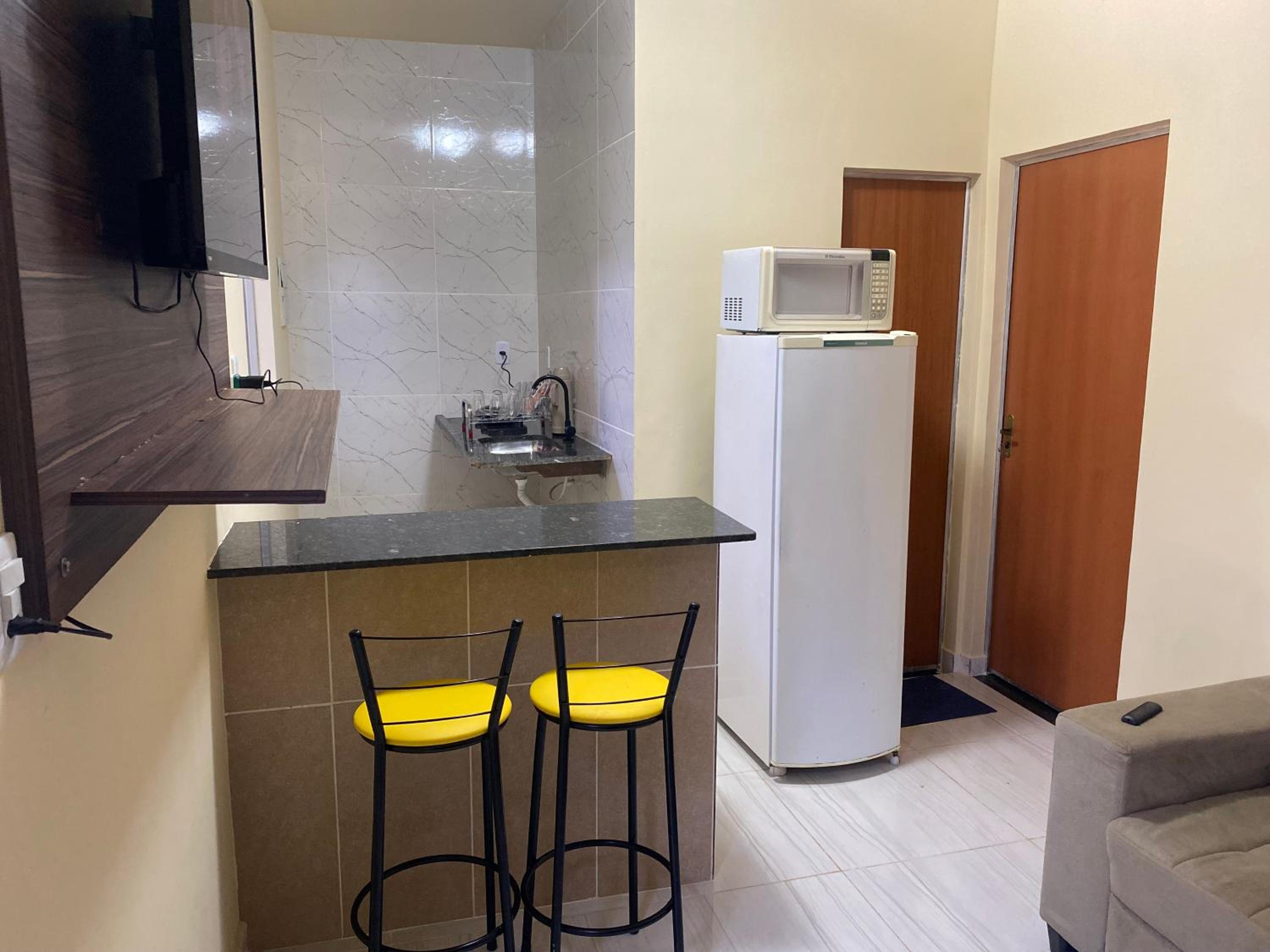 Flats com ar condicionado, garagem e internet