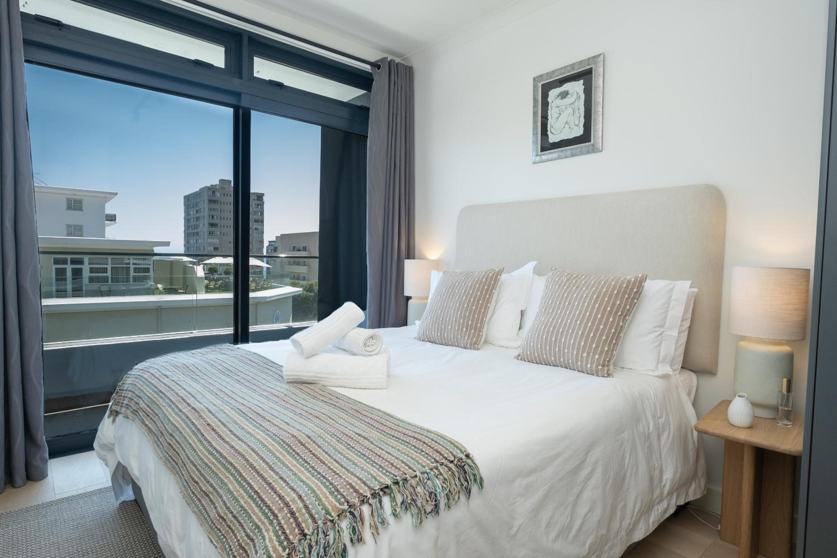 Stylish 1-Full Bedroom Apartment with a separate Living Room, Workspace and Kitchen close to the beach and best restaurants in Cape Town, secure parking view 3
