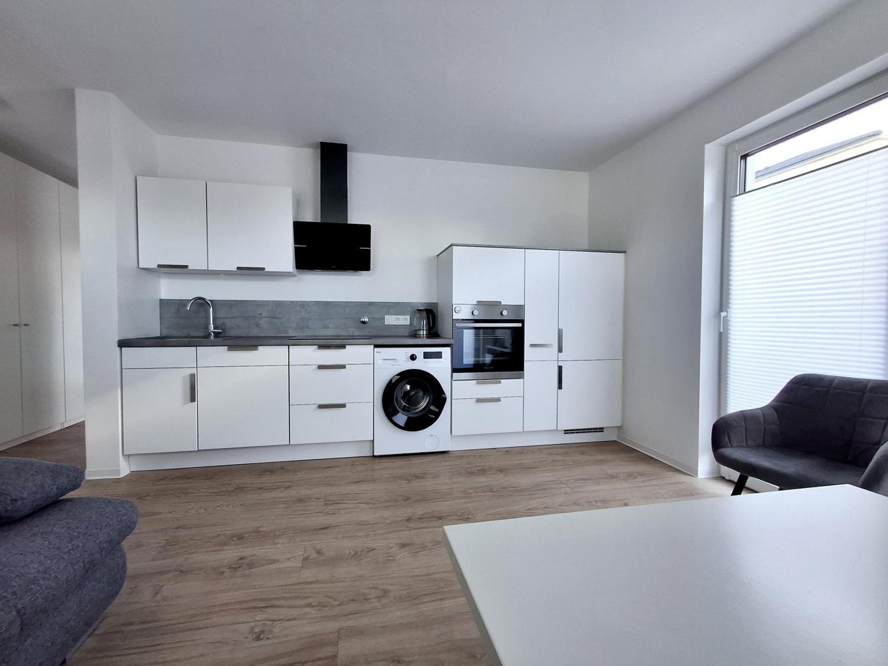 Modernes Apartment mit Terrasse & Garten, Parkplatz & 24h Self-Check-in