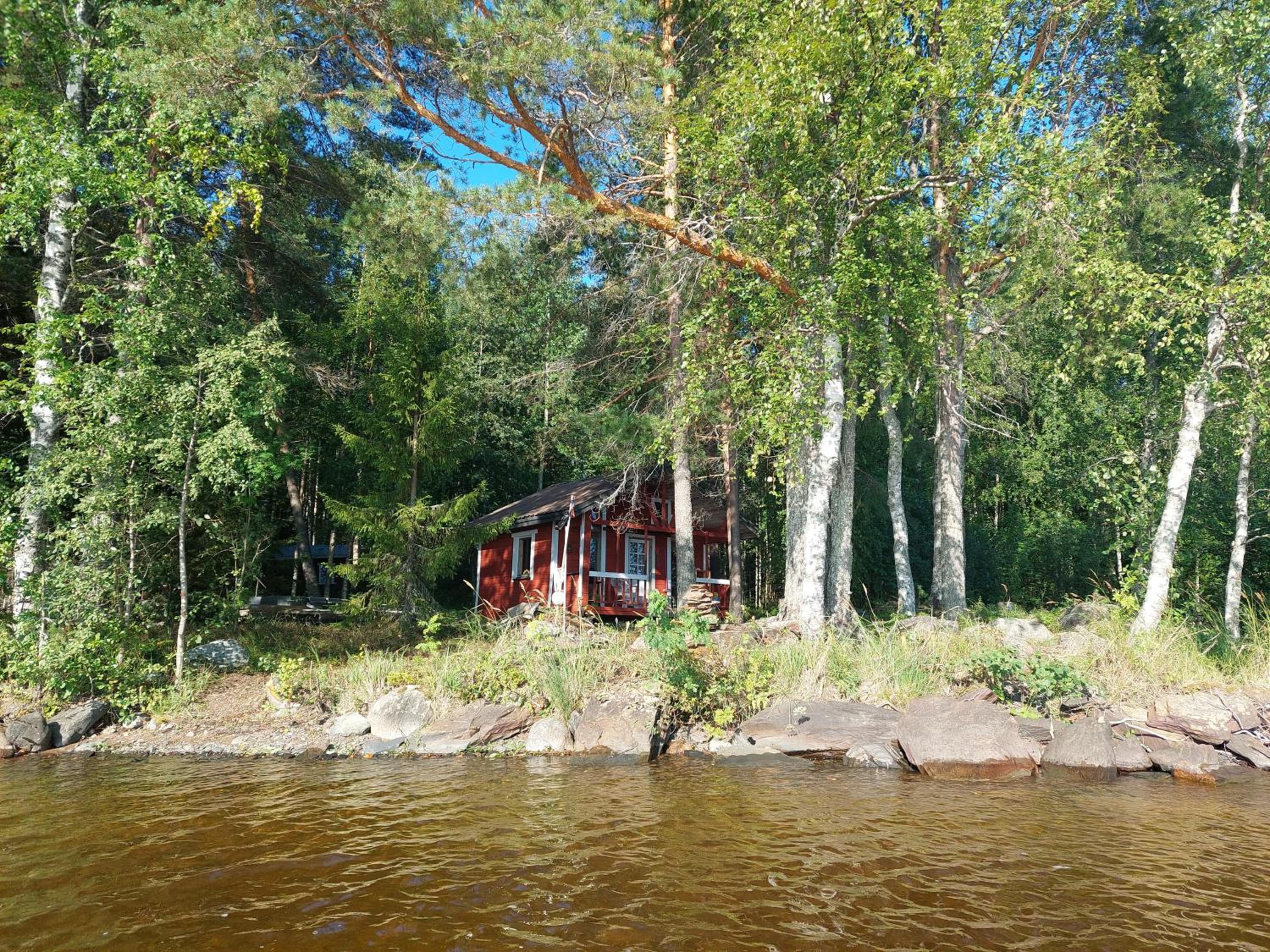 Traditional Finnish lakeside off-grid cabin