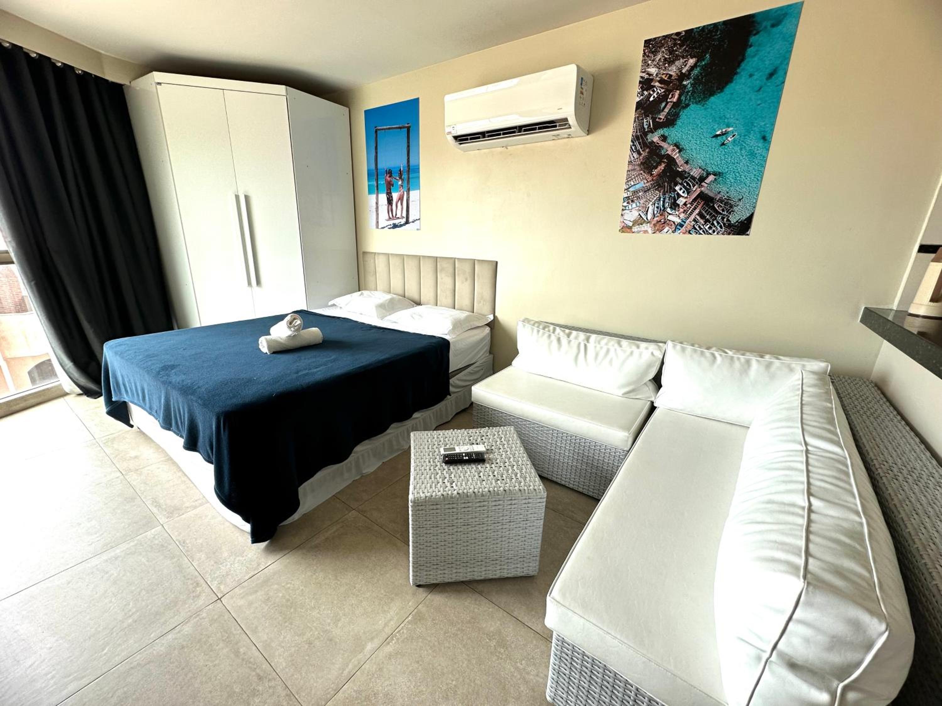 Apartamento com 2 quartos até 7 Pessoas- Orla da Praia Grande