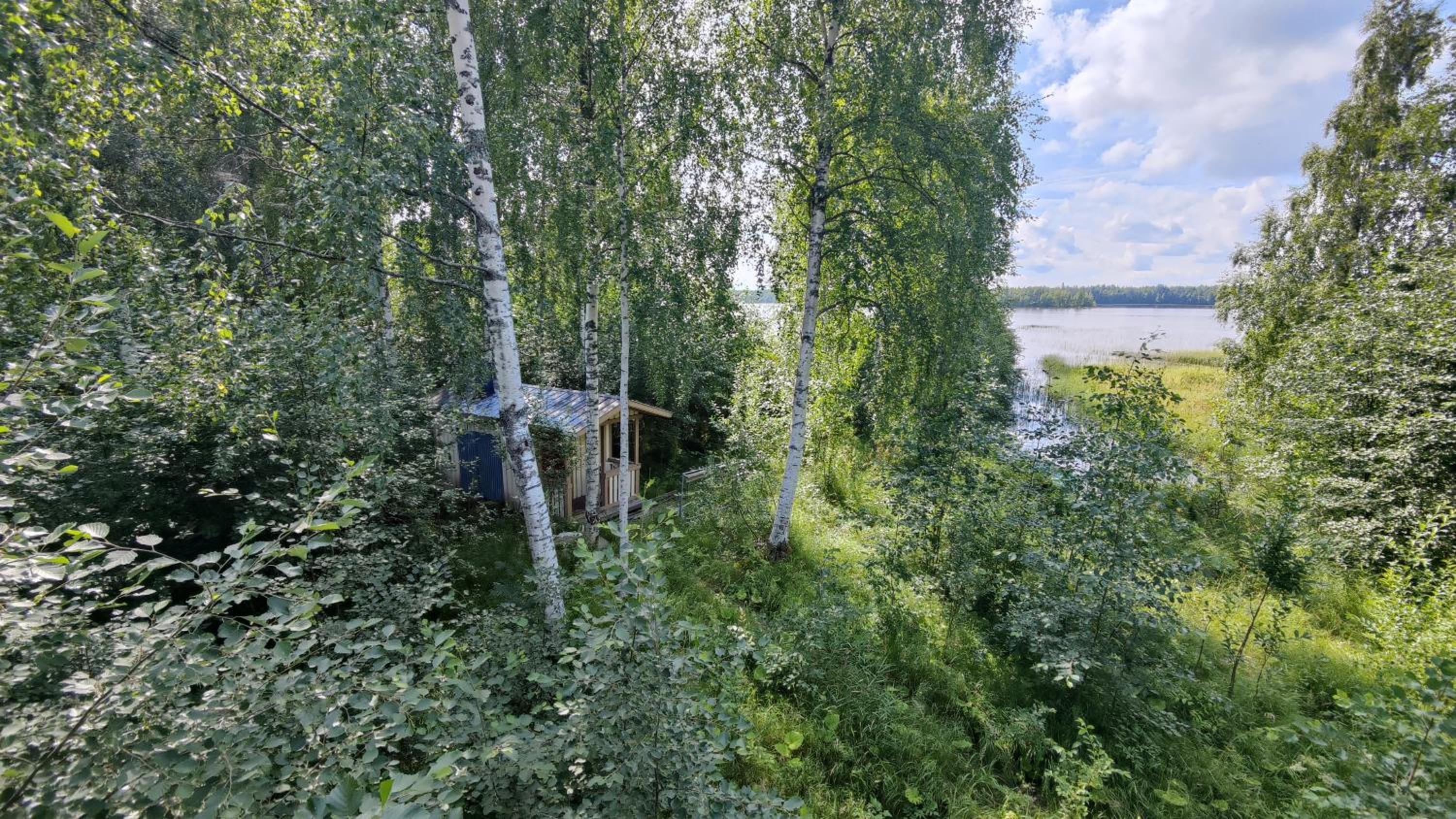 Traditional Finnish lakeside off-grid cabin