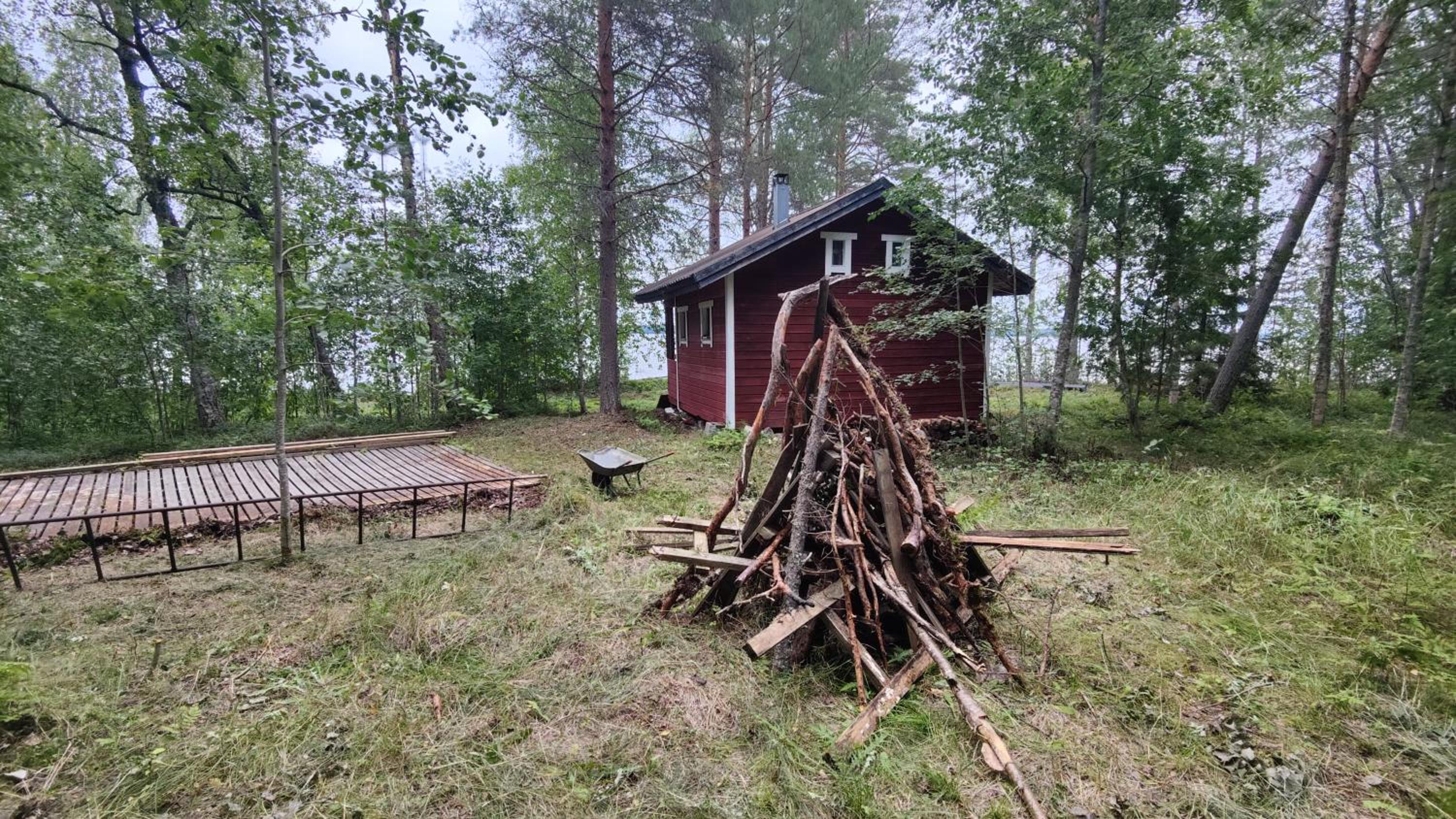 Traditional Finnish lakeside off-grid cabin