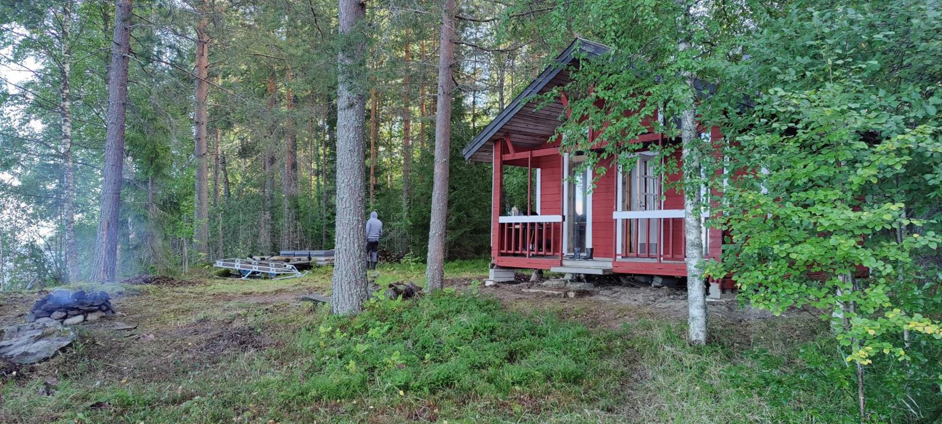 Traditional Finnish lakeside off-grid cabin