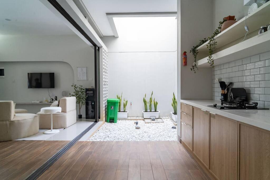 Haghi House 2BR Aesthetic Summarecon Villa with Public Pool view 3