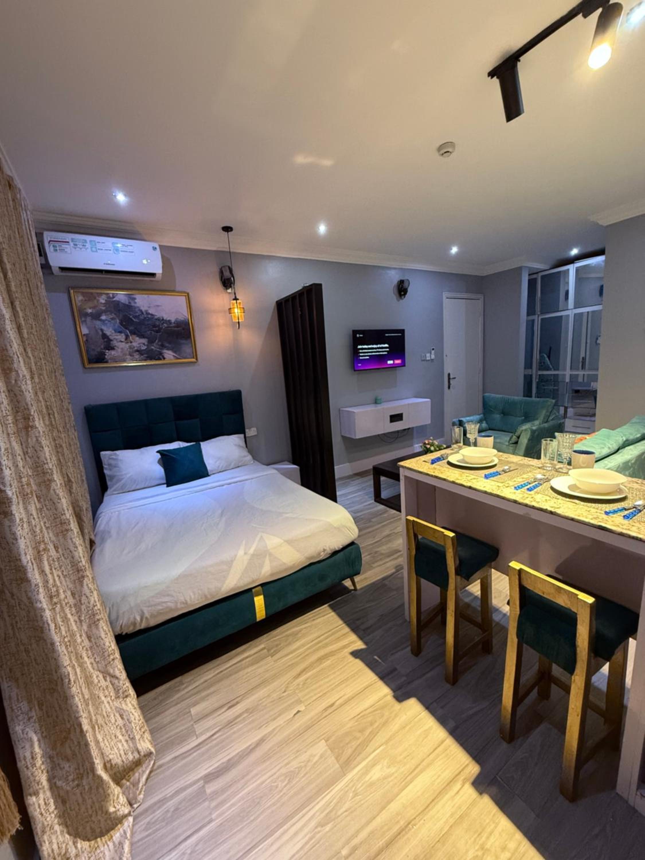 Balcony Teal Snug Open-Plan Studio Unit in Lekki Phase 1-Netflix, Wi-Fi, 24-7 Light, Washer, Kitchen view 2