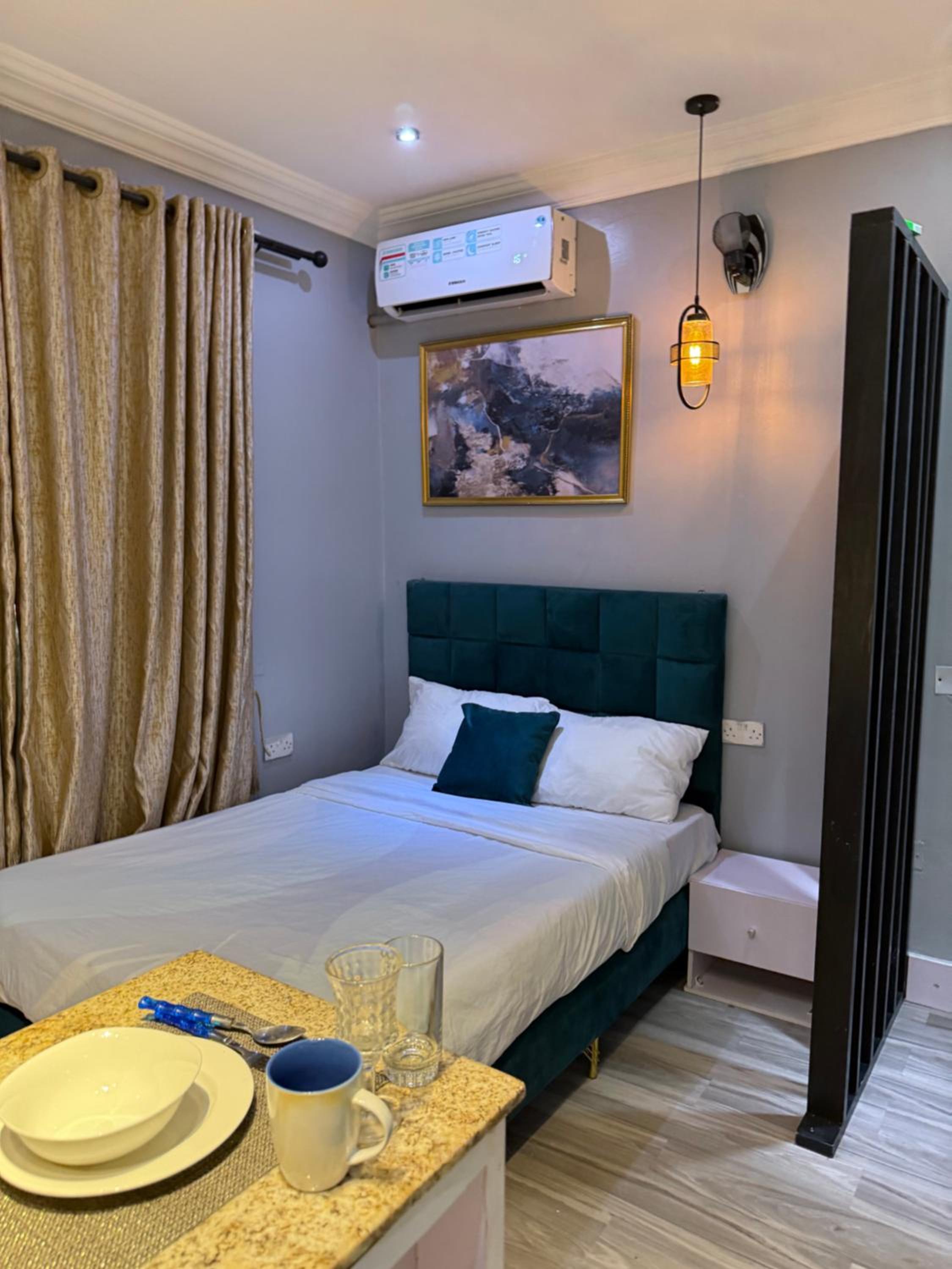 Balcony Teal Snug Open-Plan Studio Unit in Lekki Phase 1-Netflix, Wi-Fi, 24-7 Light, Washer, Kitchen view 3