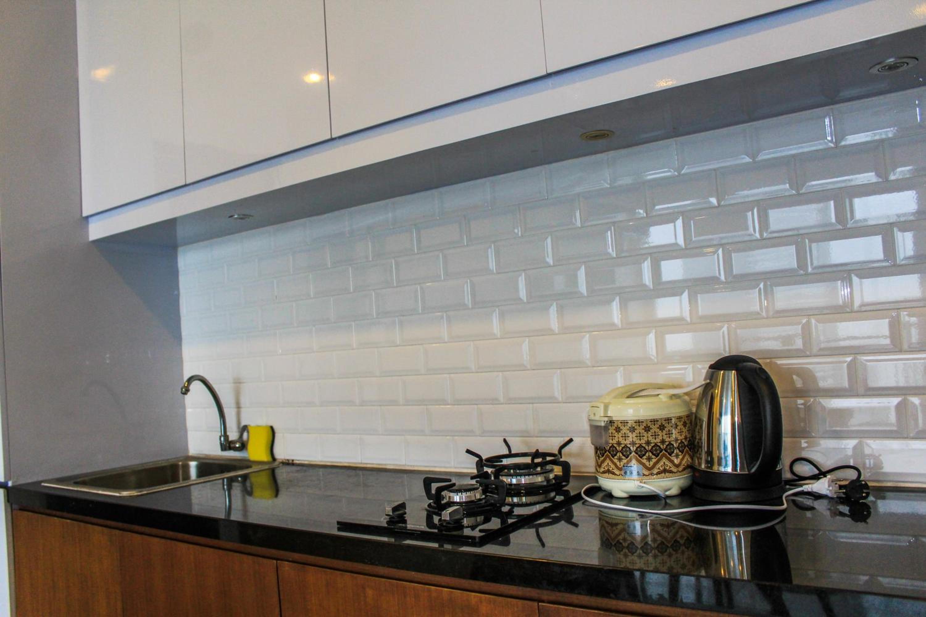 Homey and Warm 3BR Apartment at Ambassade Residences By Travelio