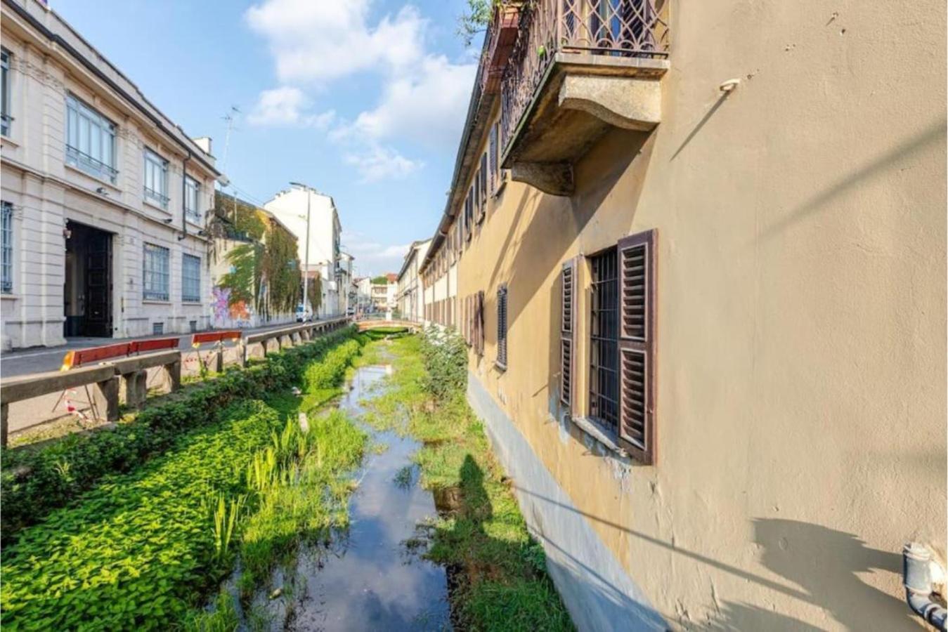 Tiny House on Water Surrounded by Greenery