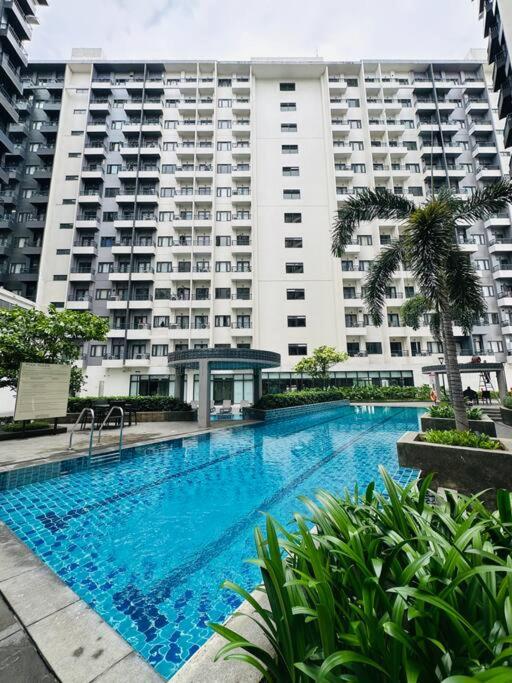 Nature-Inspired 2BR with Pool, WiFi and Tropical Vibes at Spring Residences view 4