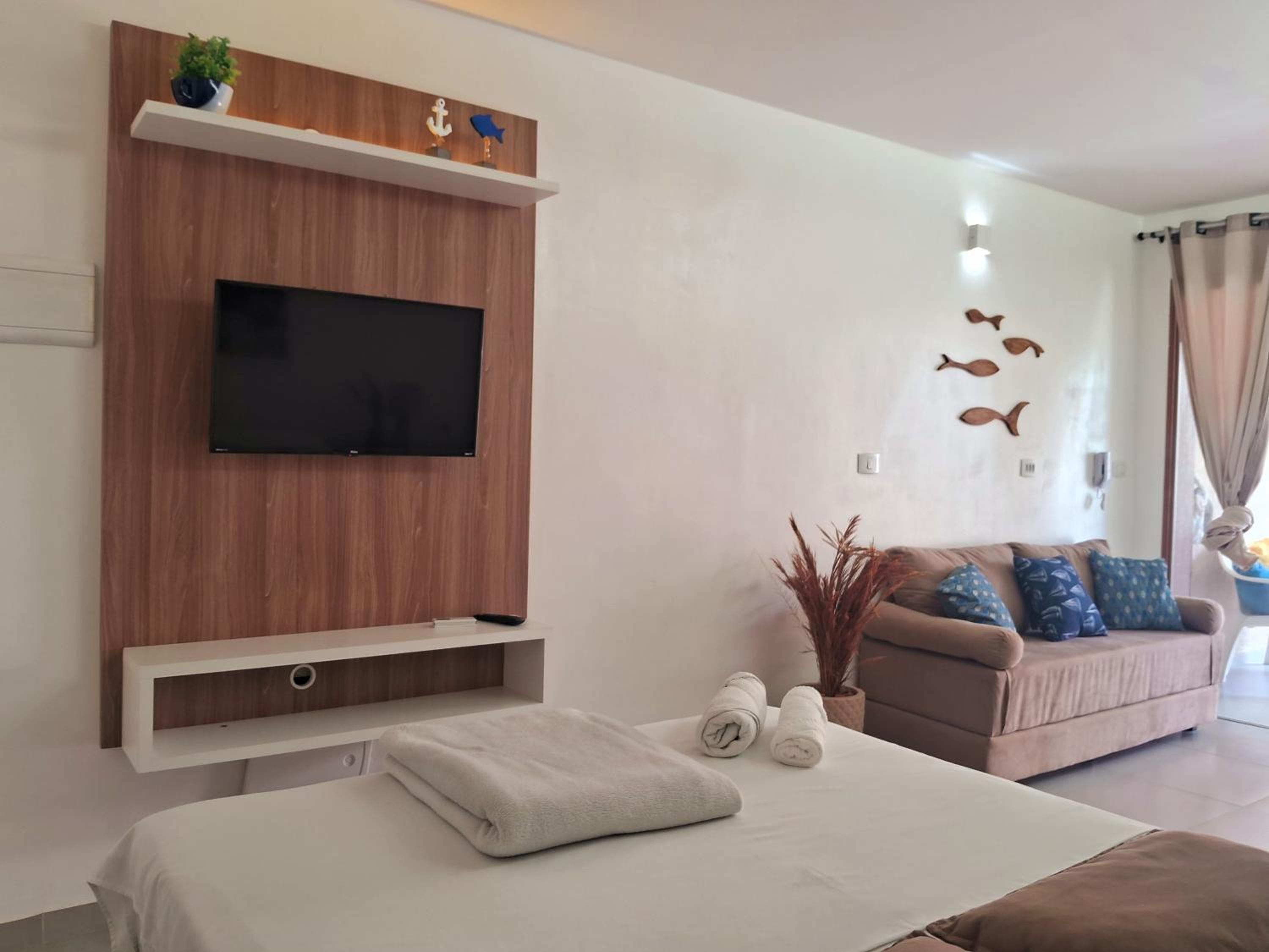 FLAT ENCANTADOR A UM PASSO DA PRAIA