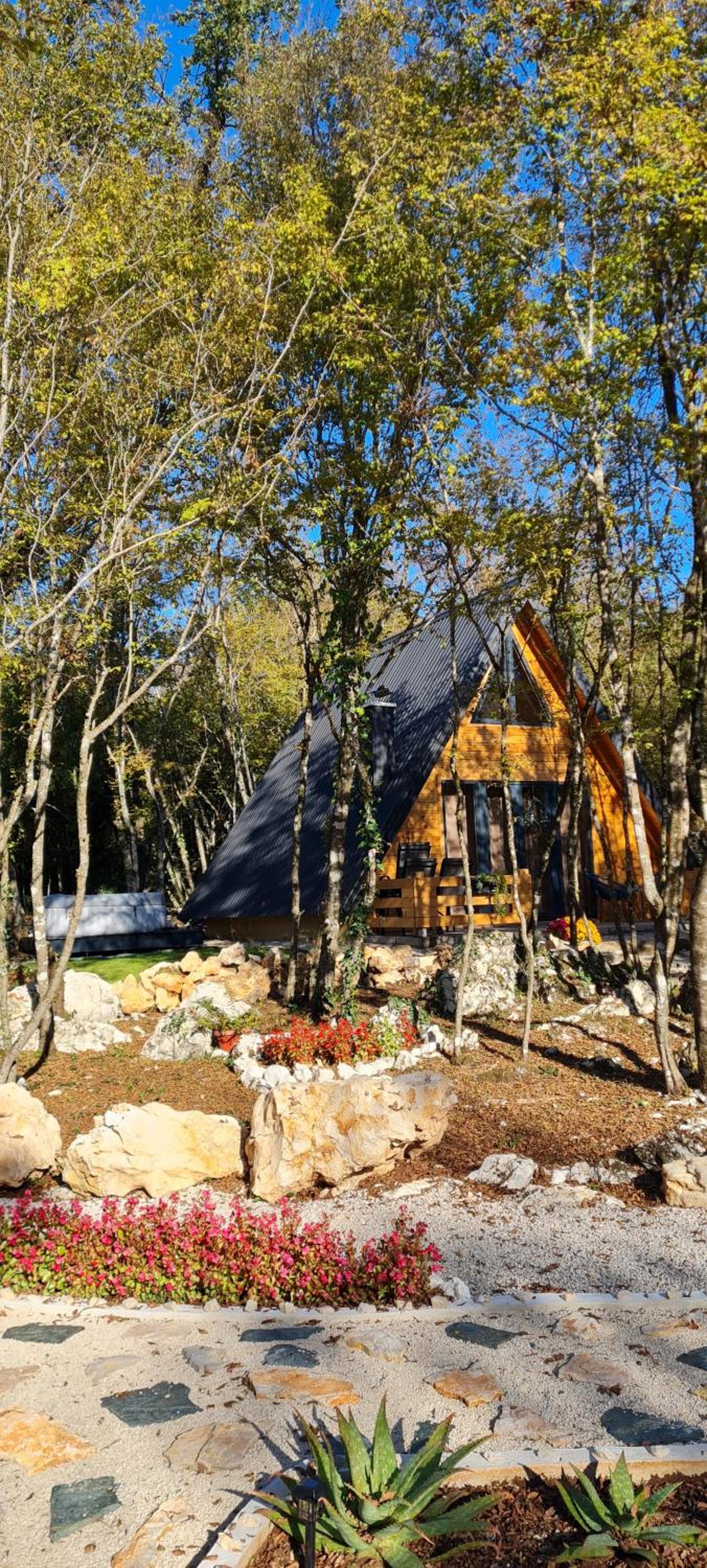 Woodland paradise Charming wooden houses in stone