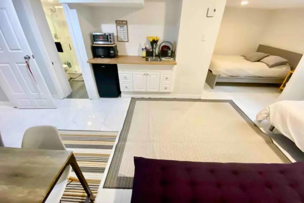 Kat Aylmer Private Studio, attached bathroom, TV, and kitchenette