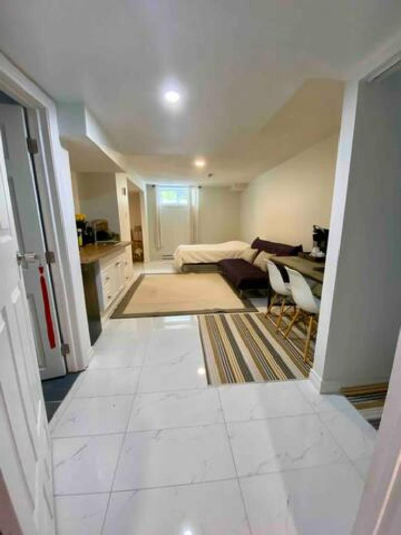 Kat Aylmer Private Studio, attached bathroom, TV, and kitchenette