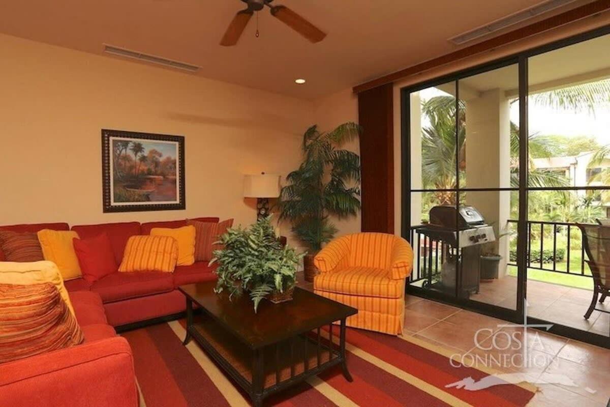 Luxe! Impressively designed 2nd-floor unit in Coco done in red and orange hues