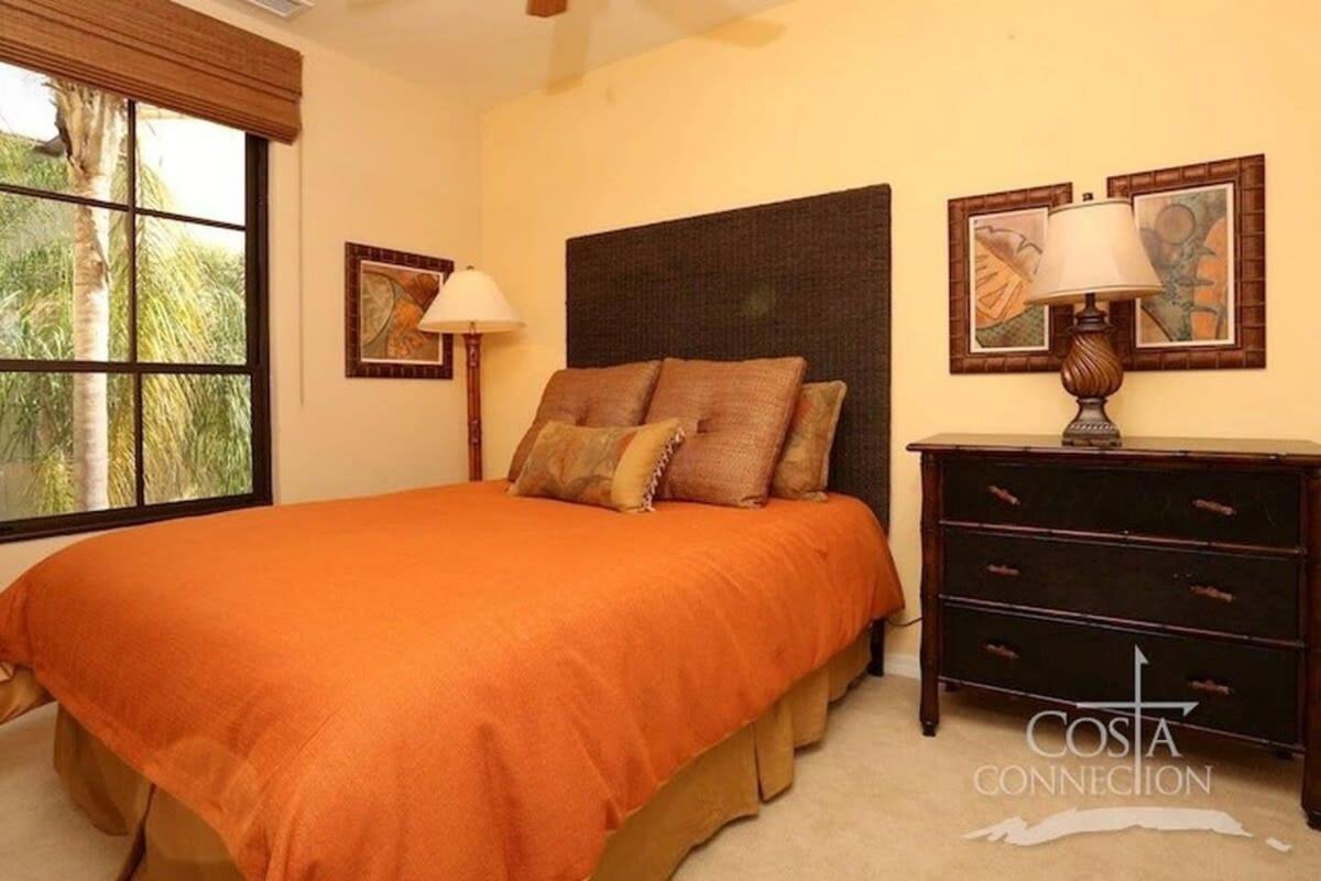 Luxe! Impressively designed 2nd-floor unit in Coco done in red and orange hues
