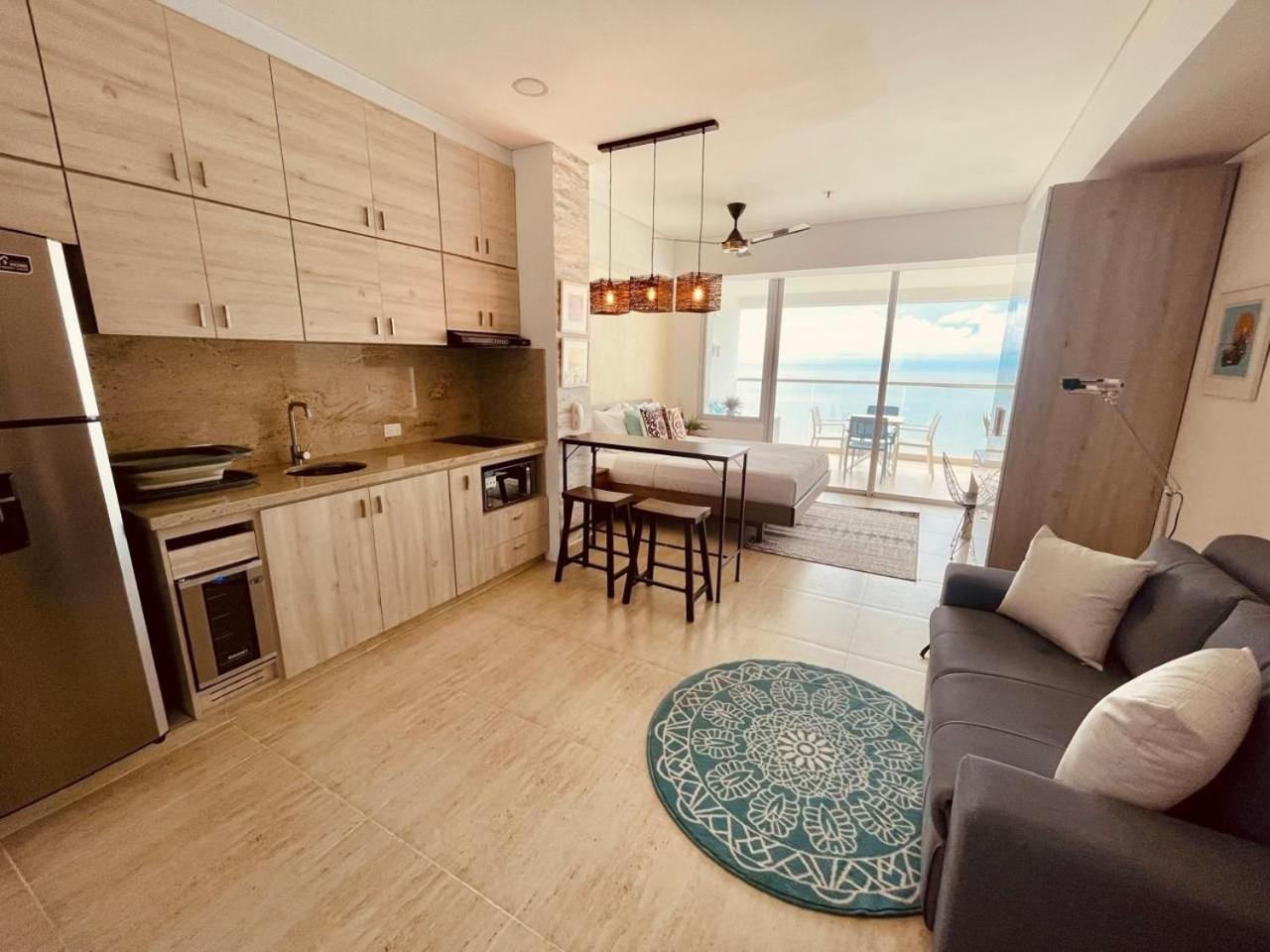 New exclusive beachfront condo