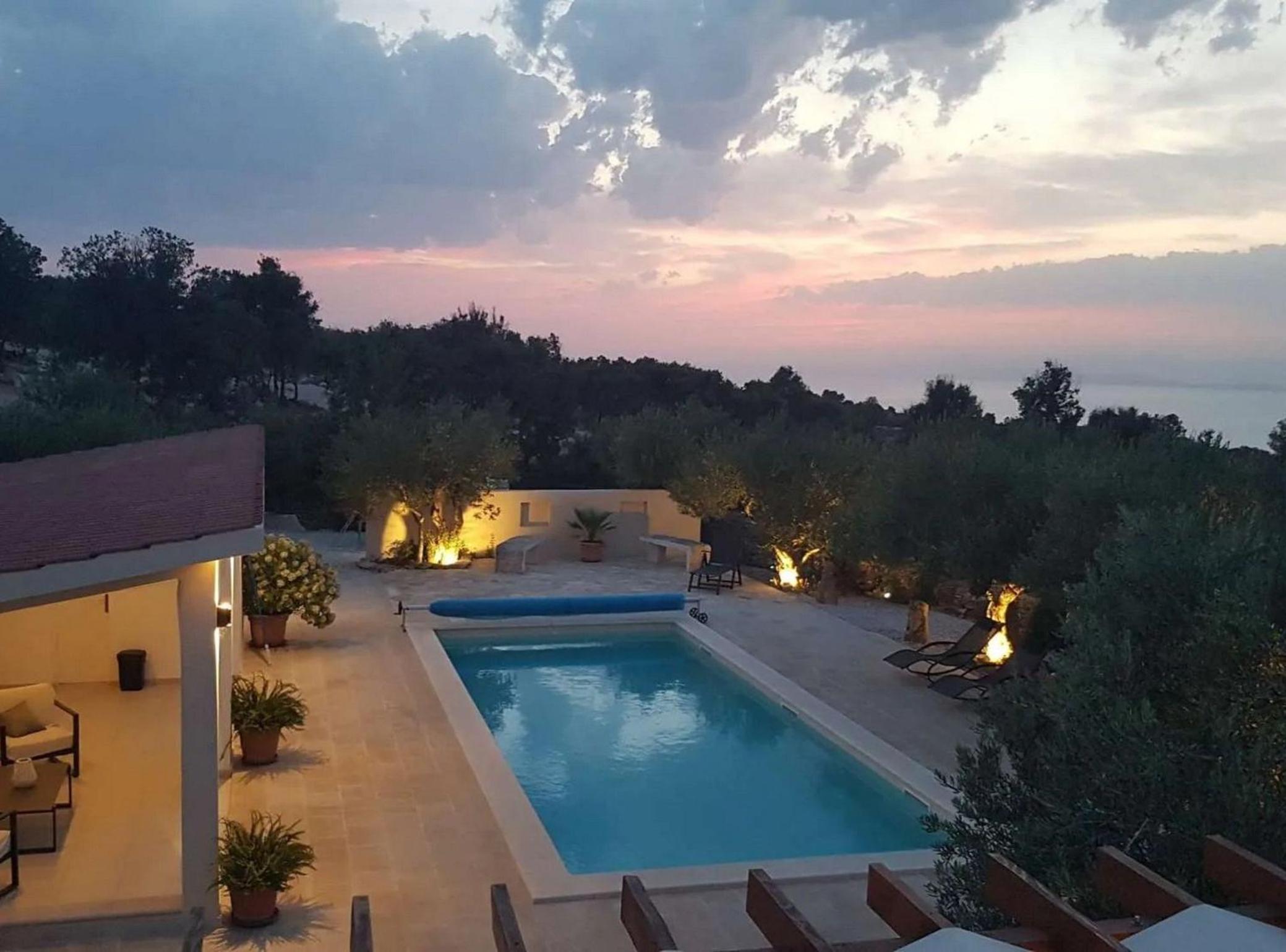 Secluded Oasis with Pool, Outdoor Kitchen, & Landscaped Terraces view 5