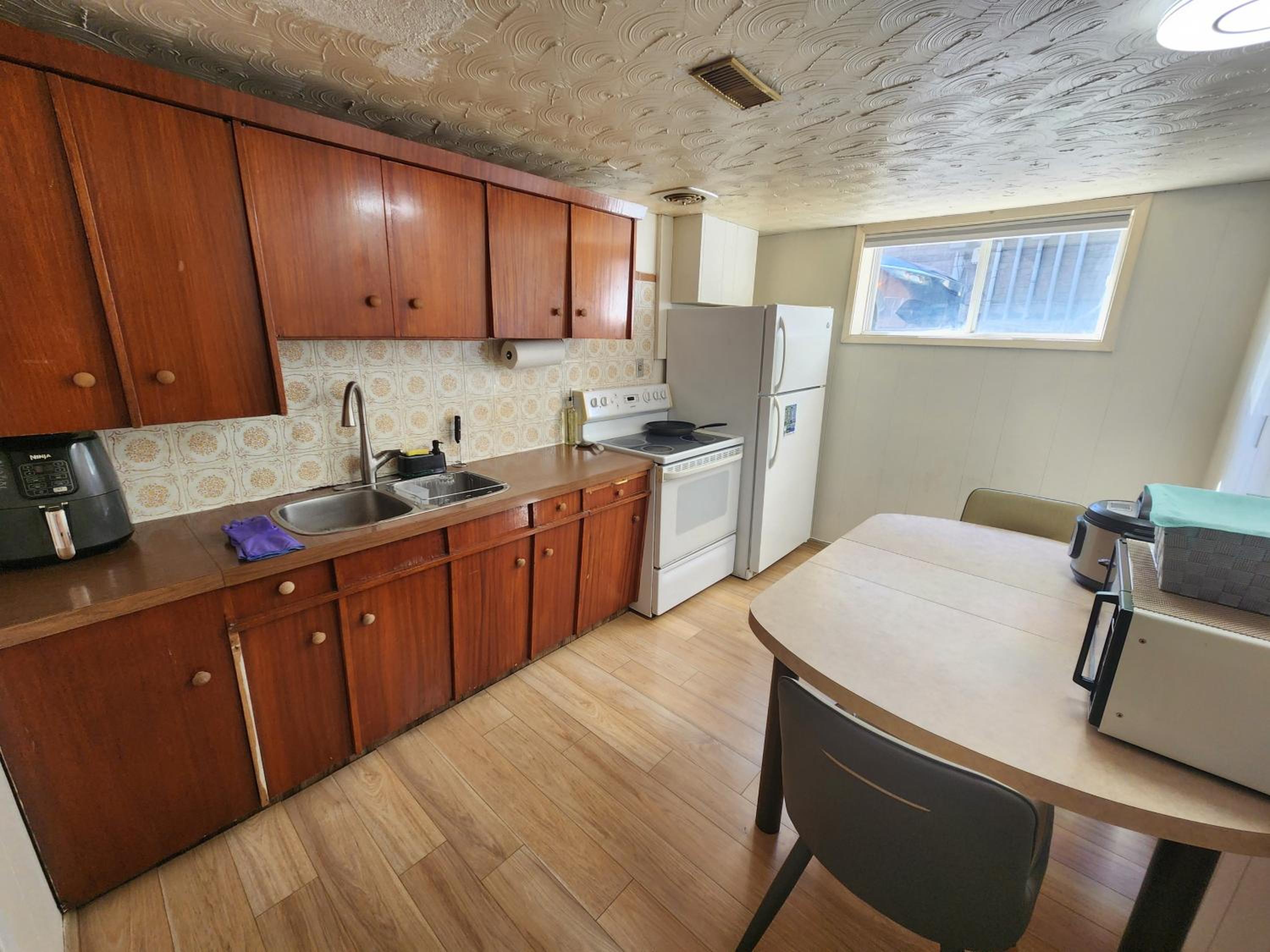 Private room with shared space in a basement