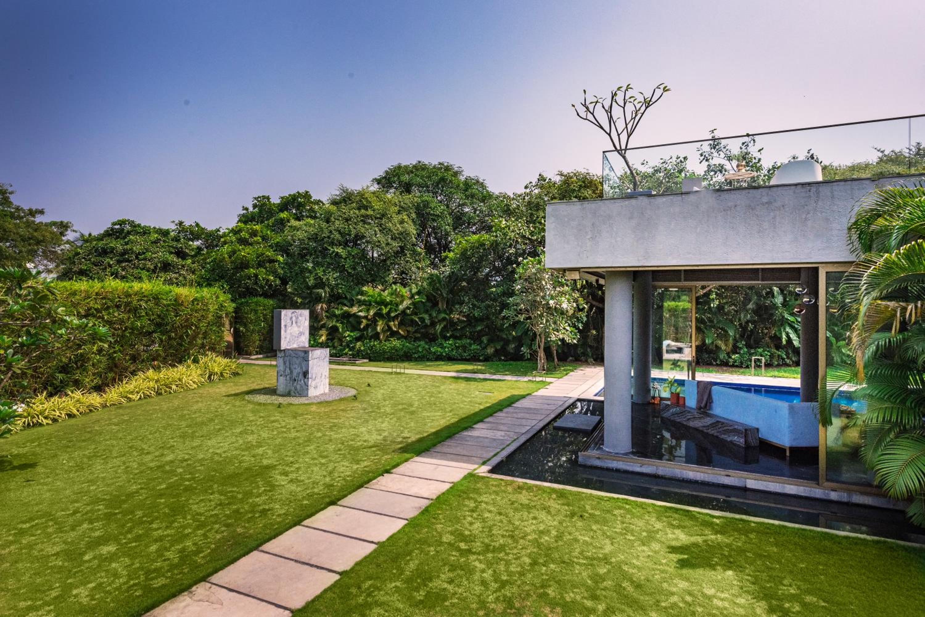 SaffronStays Glasshouse 91 - 4BR luxury villa with pool, art installations, lawns & outdoor dining