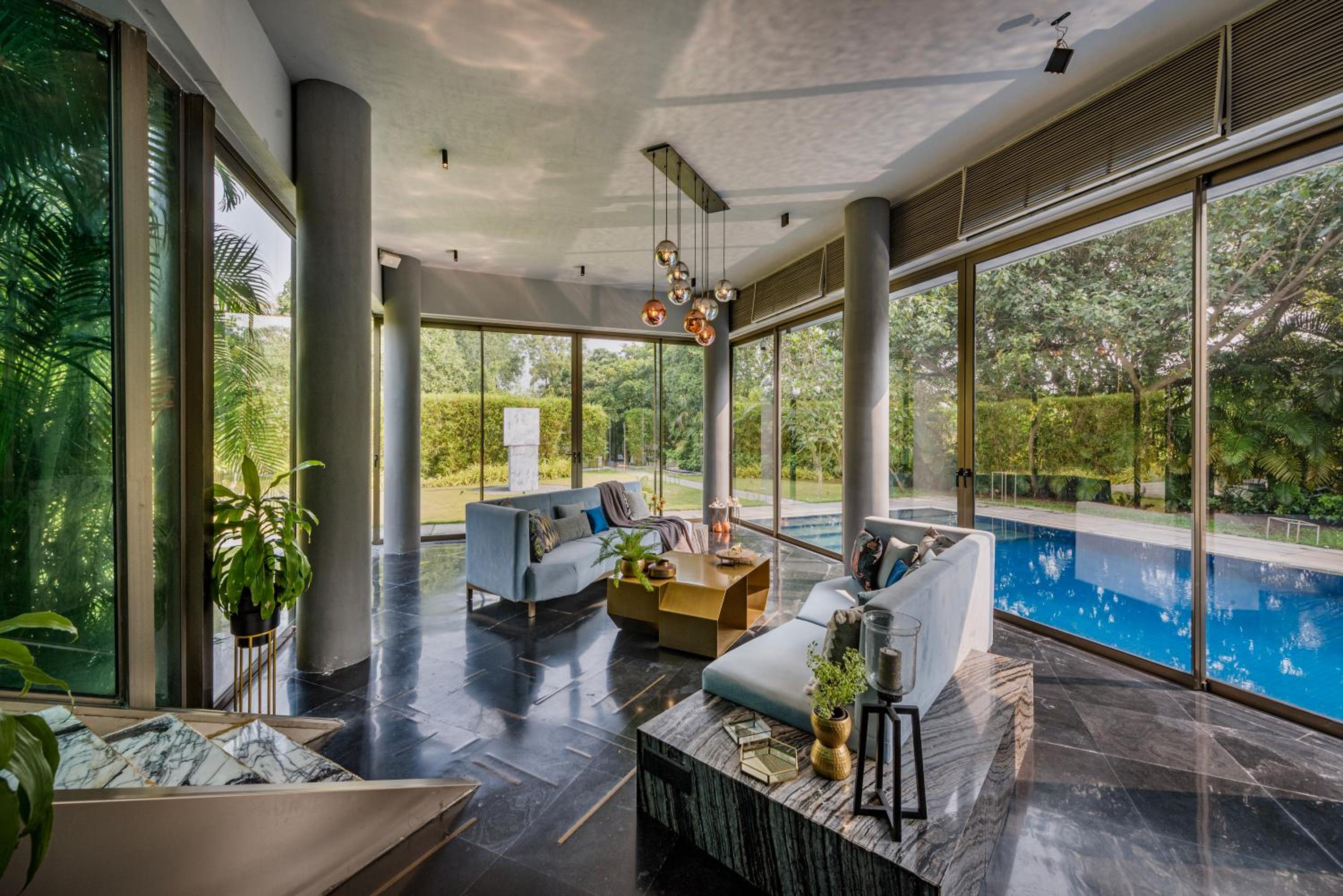 SaffronStays Glasshouse 91 - 4BR luxury villa with pool, art installations, lawns & outdoor dining