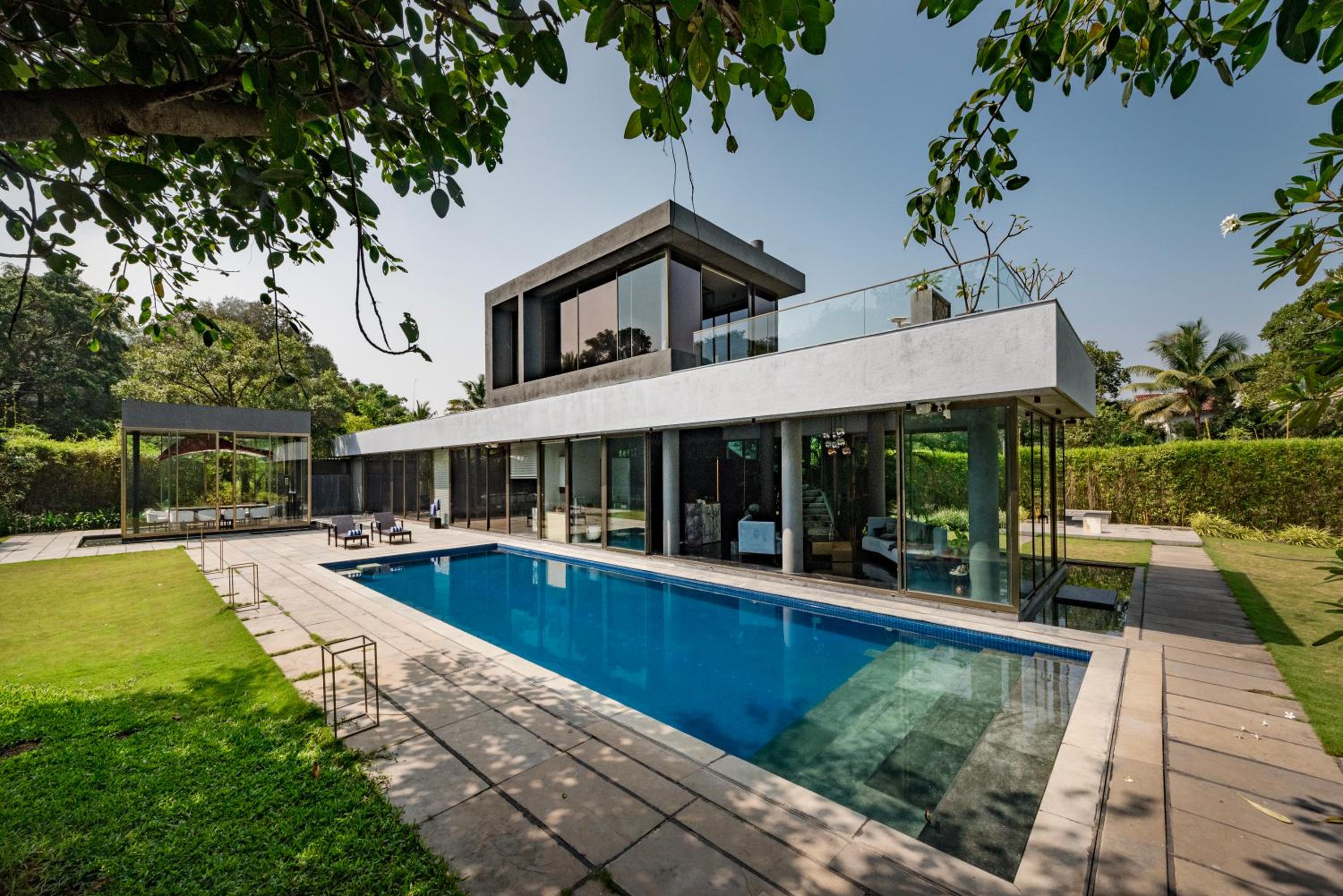 SaffronStays Glasshouse 91 - 4BR luxury villa with pool, art installations, lawns & outdoor dining
