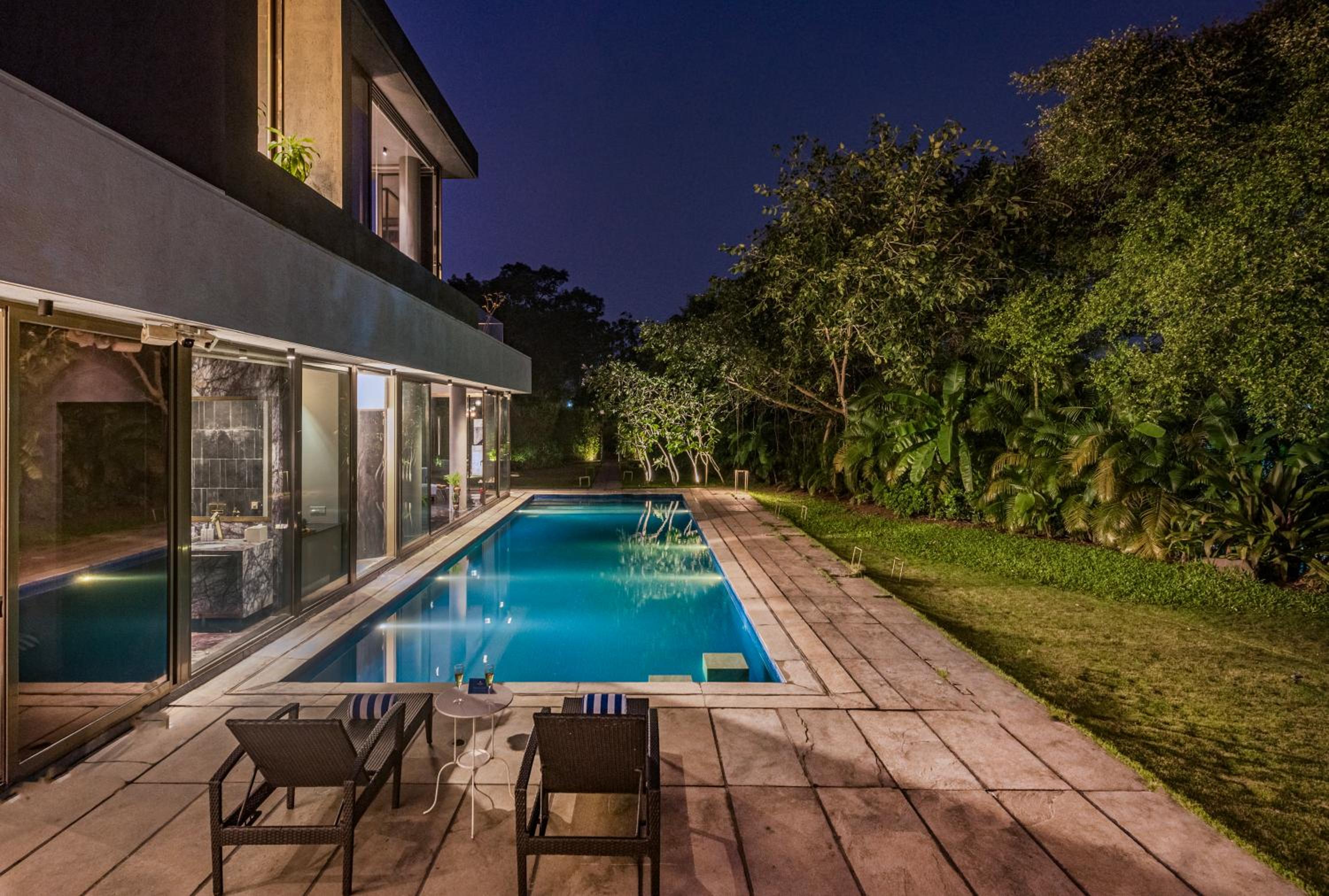 SaffronStays Glasshouse 91 - 4BR luxury villa with pool, art installations, lawns & outdoor dining