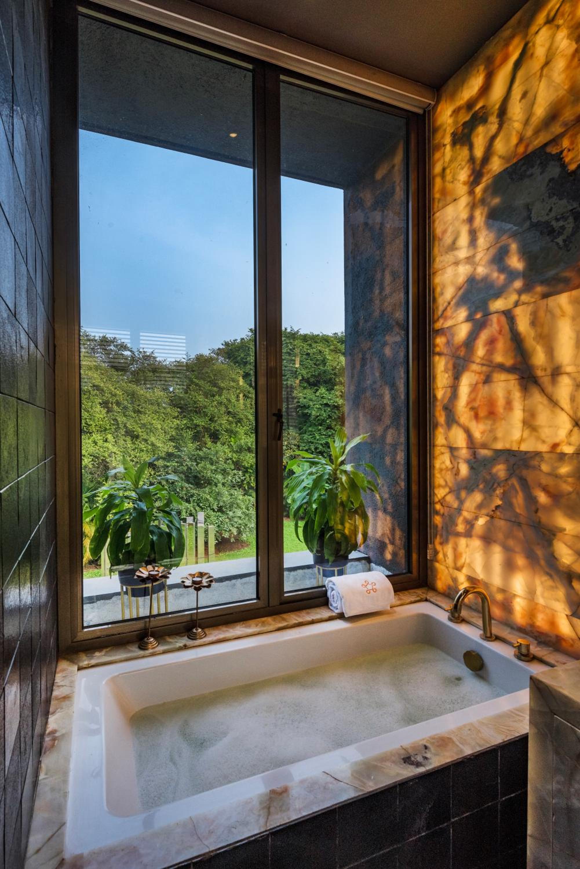 SaffronStays Glasshouse 91 - 4BR luxury villa with pool, art installations, lawns & outdoor dining