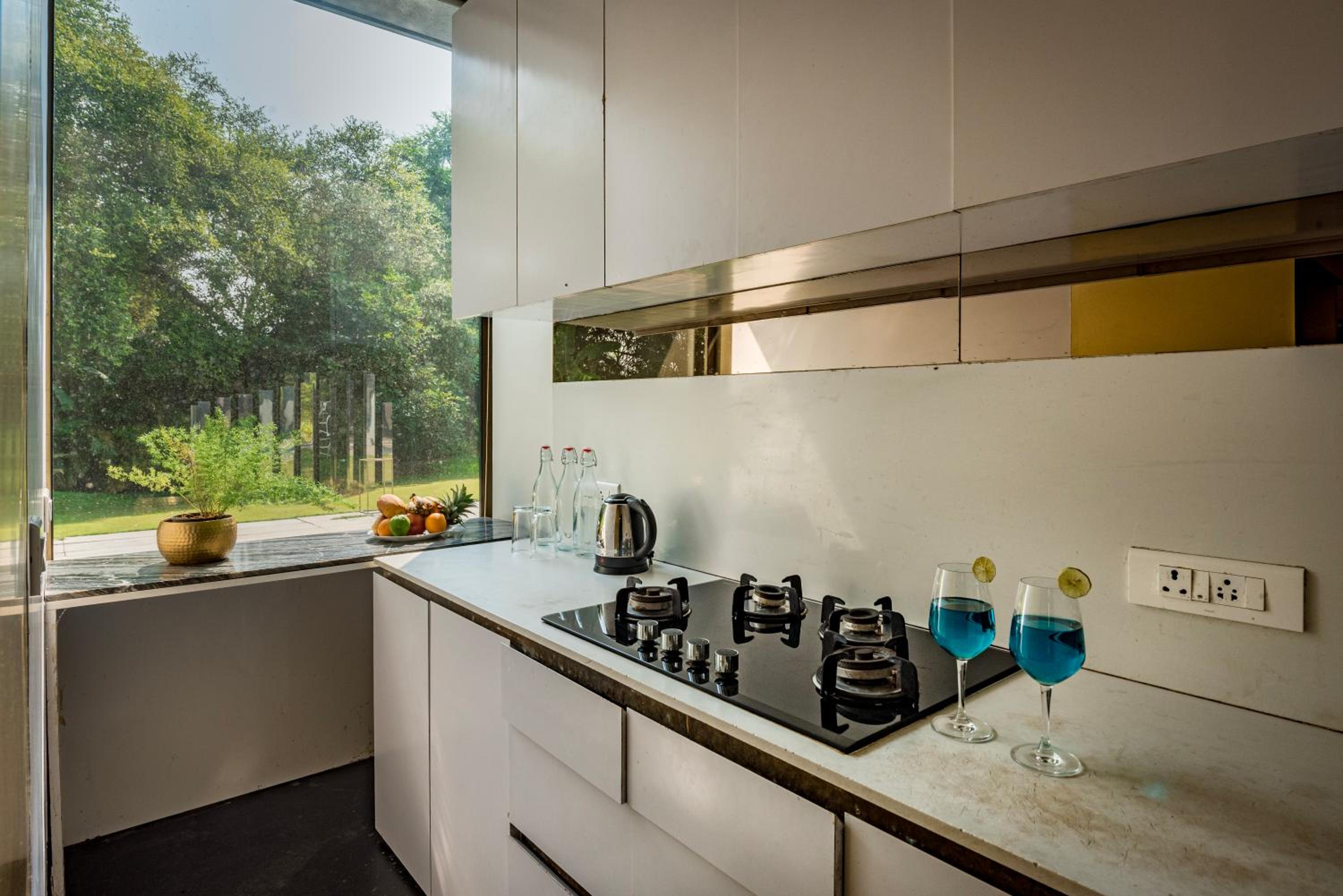 SaffronStays Glasshouse 91 - 4BR luxury villa with pool, art installations, lawns & outdoor dining