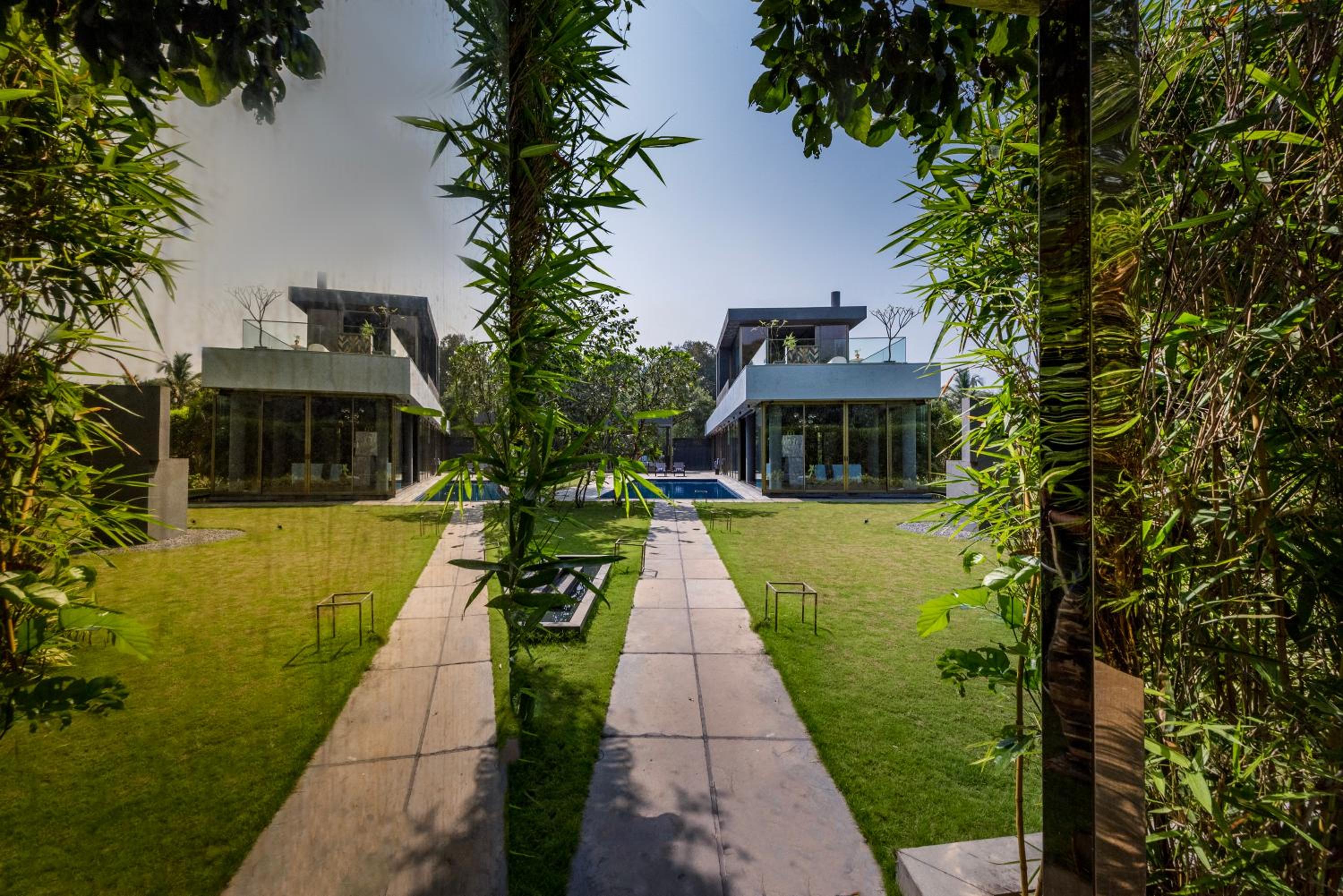 SaffronStays Glasshouse 91 - 4BR luxury villa with pool, art installations, lawns & outdoor dining