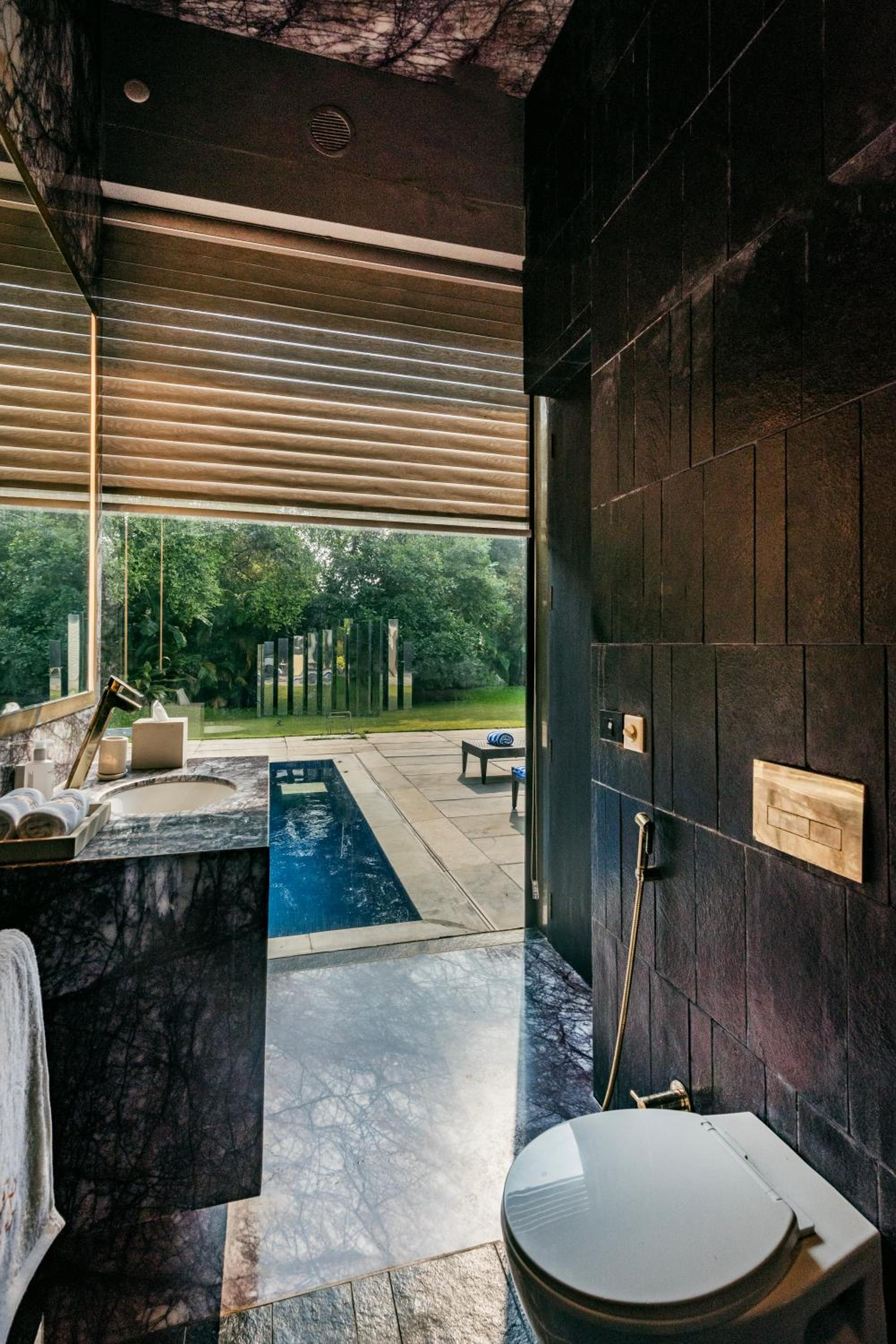 SaffronStays Glasshouse 91 - 4BR luxury villa with pool, art installations, lawns & outdoor dining