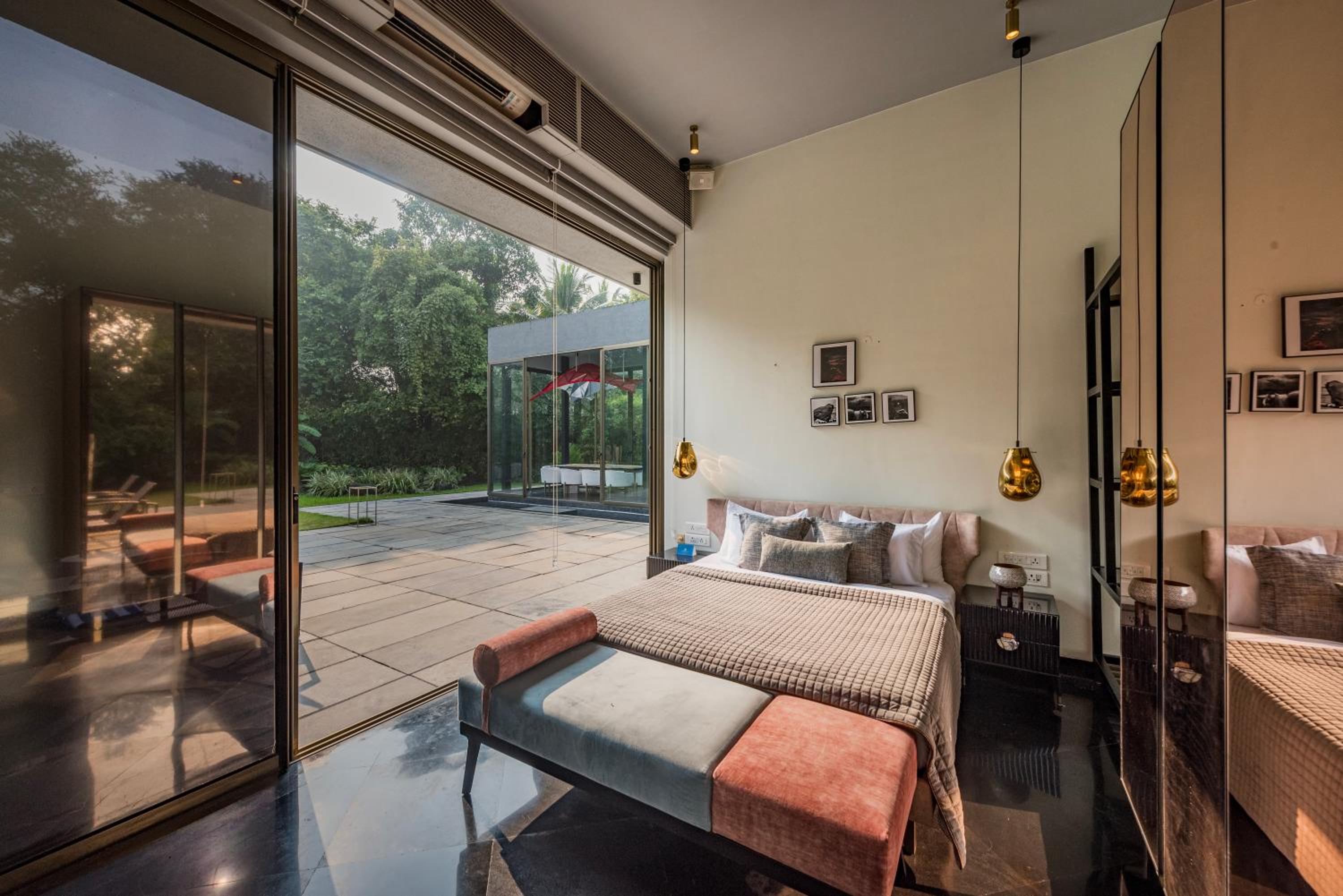 SaffronStays Glasshouse 91 - 4BR luxury villa with pool, art installations, lawns & outdoor dining