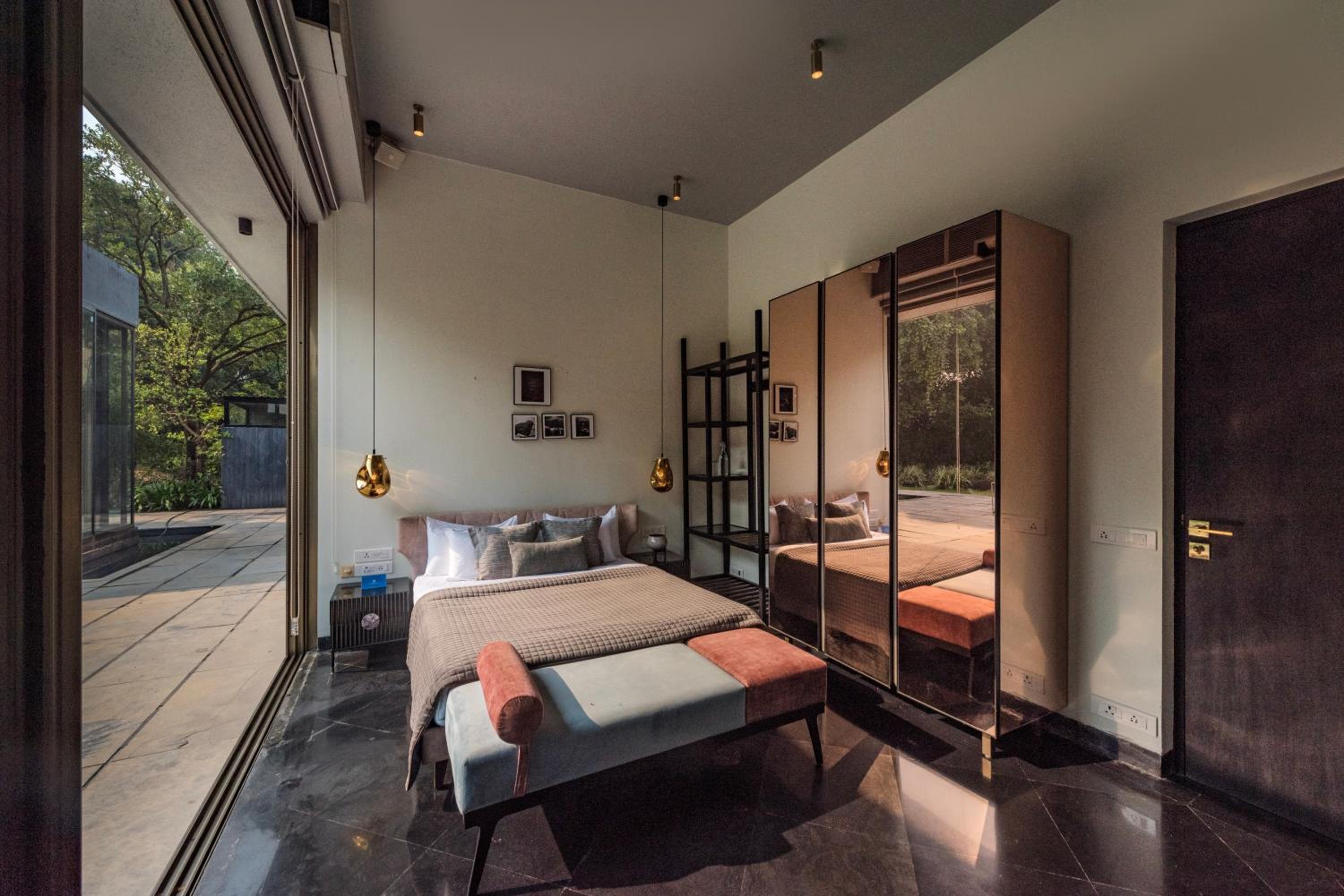 SaffronStays Glasshouse 91 - 4BR luxury villa with pool, art installations, lawns & outdoor dining