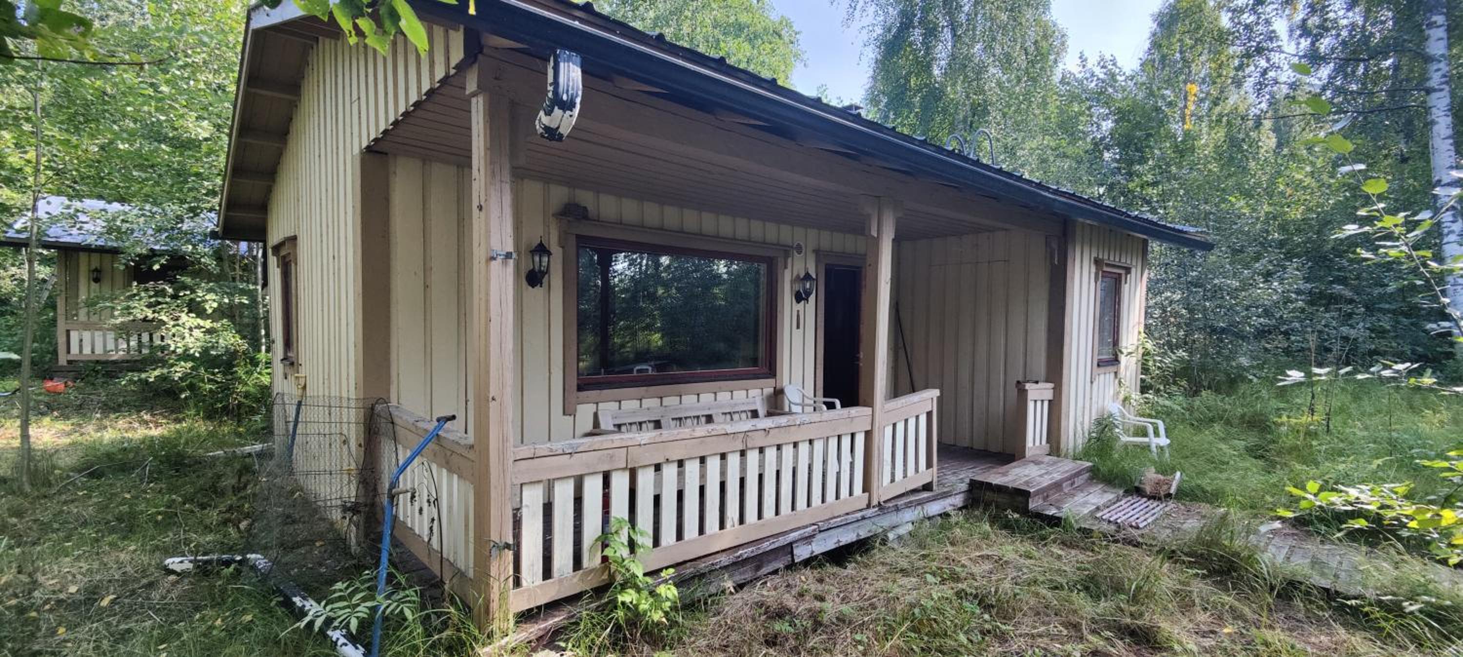 Traditional Finnish lakeside off-grid cabin