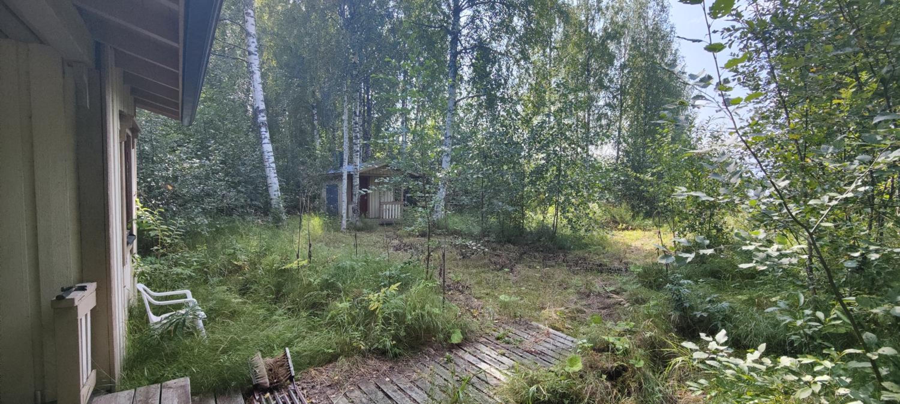 Traditional Finnish lakeside off-grid cabin