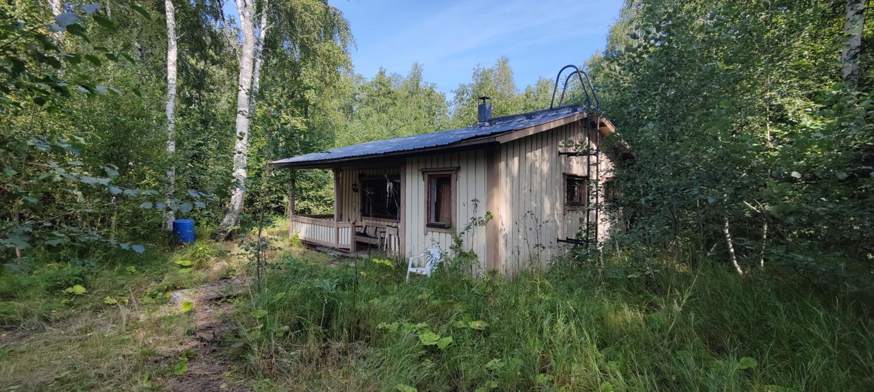 Traditional Finnish lakeside off-grid cabin
