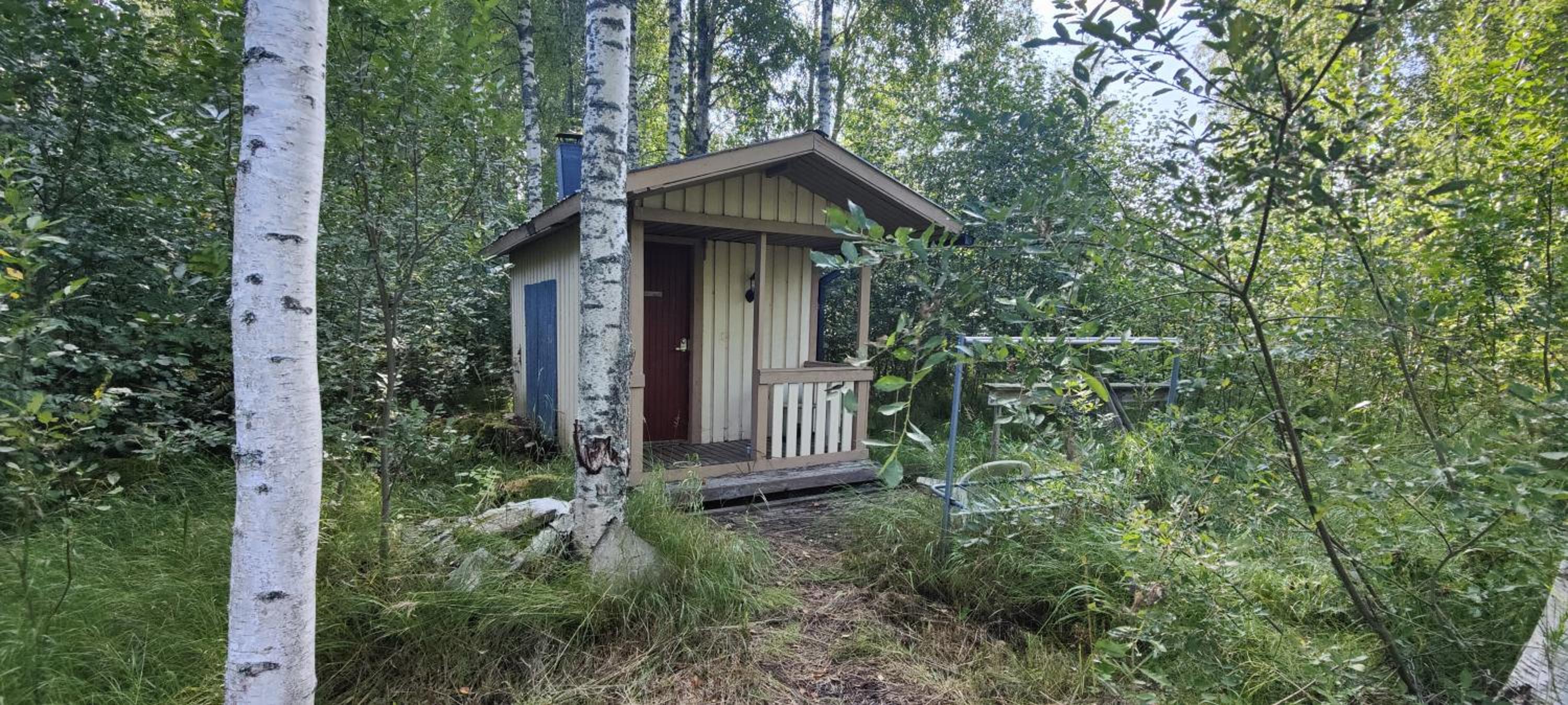 Traditional Finnish lakeside off-grid cabin