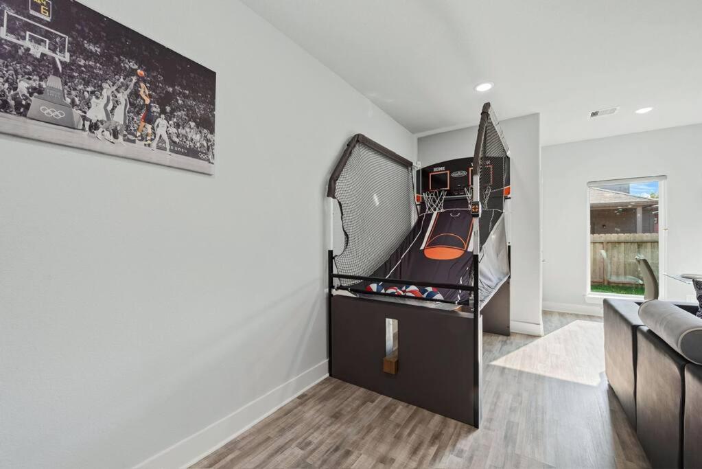 Modern 2024 Townhome with Indoor Hoops Huge TVs and Gray Chic Design view 3