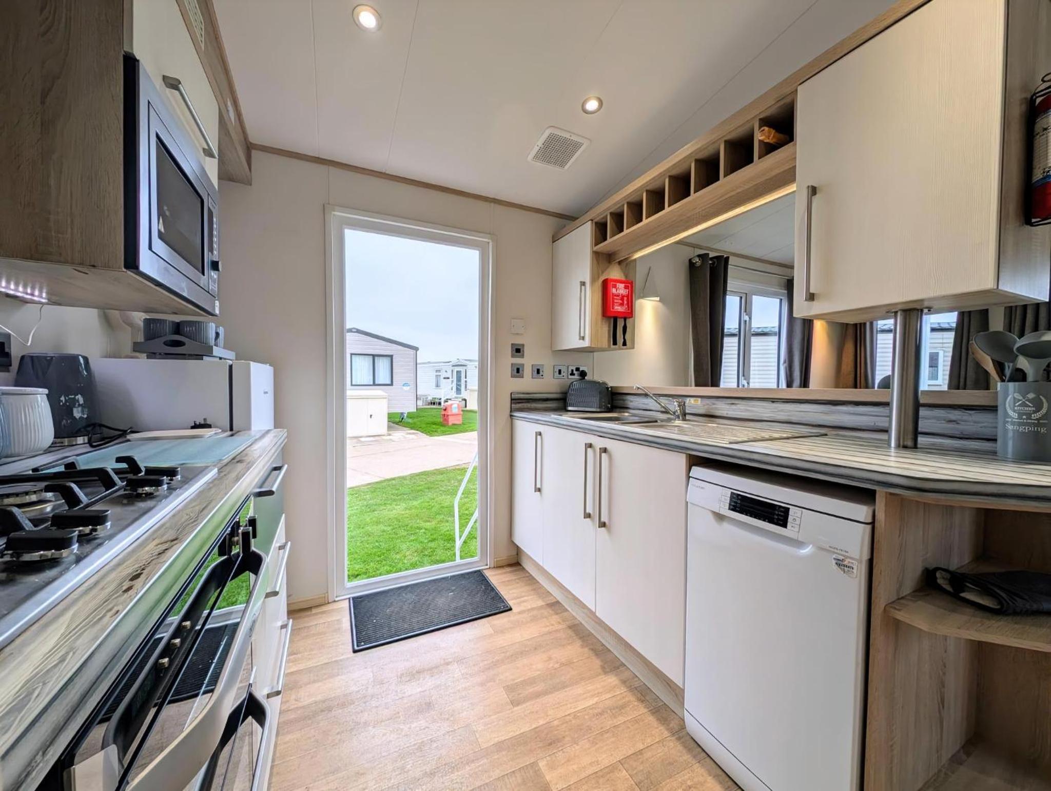 Beautiful 8 Berth Caravan With Decking At Hopton Holiday Village Ref 80016W view 2