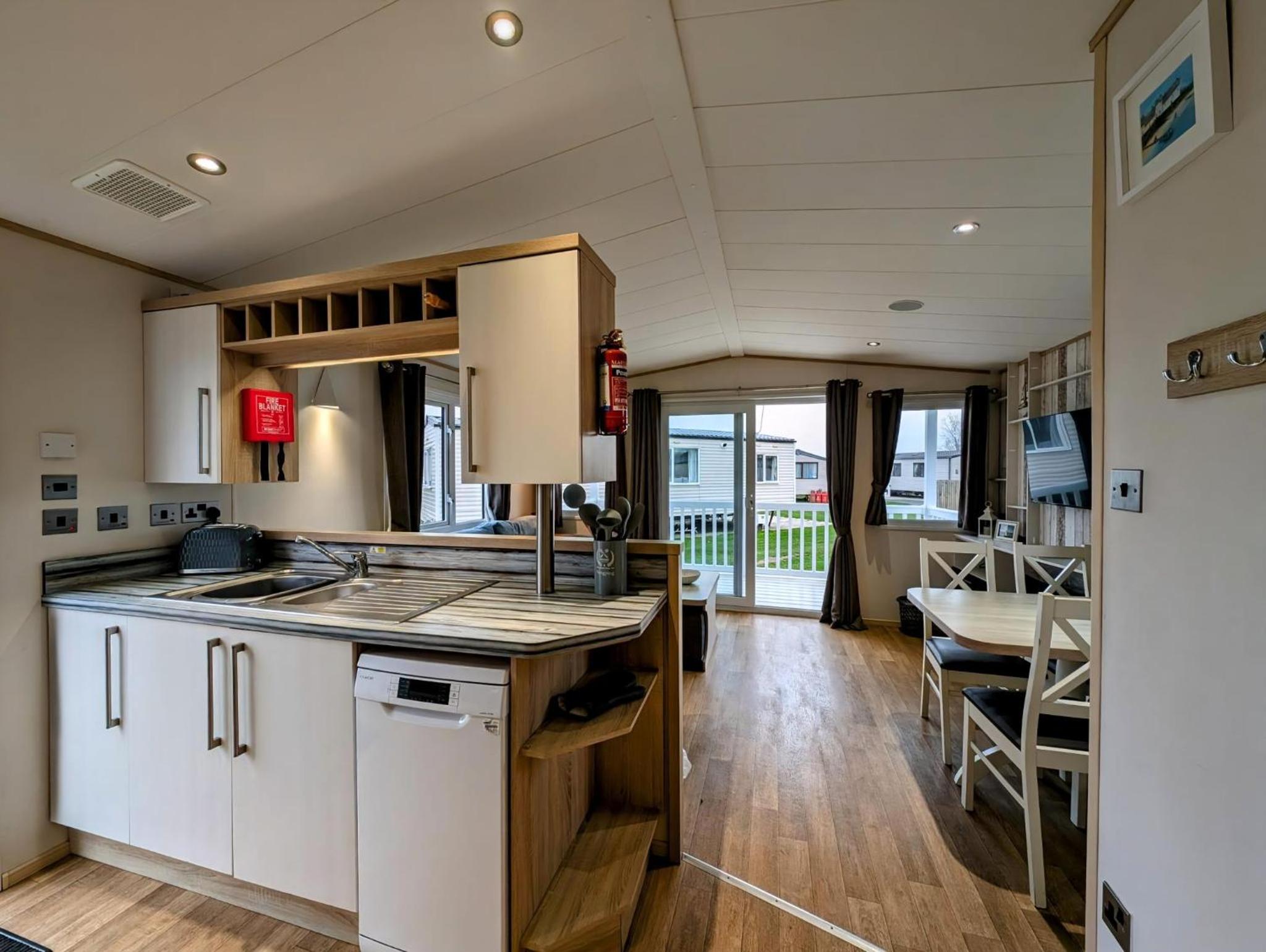 Beautiful 8 Berth Caravan With Decking At Hopton Holiday Village Ref 80016W view 3