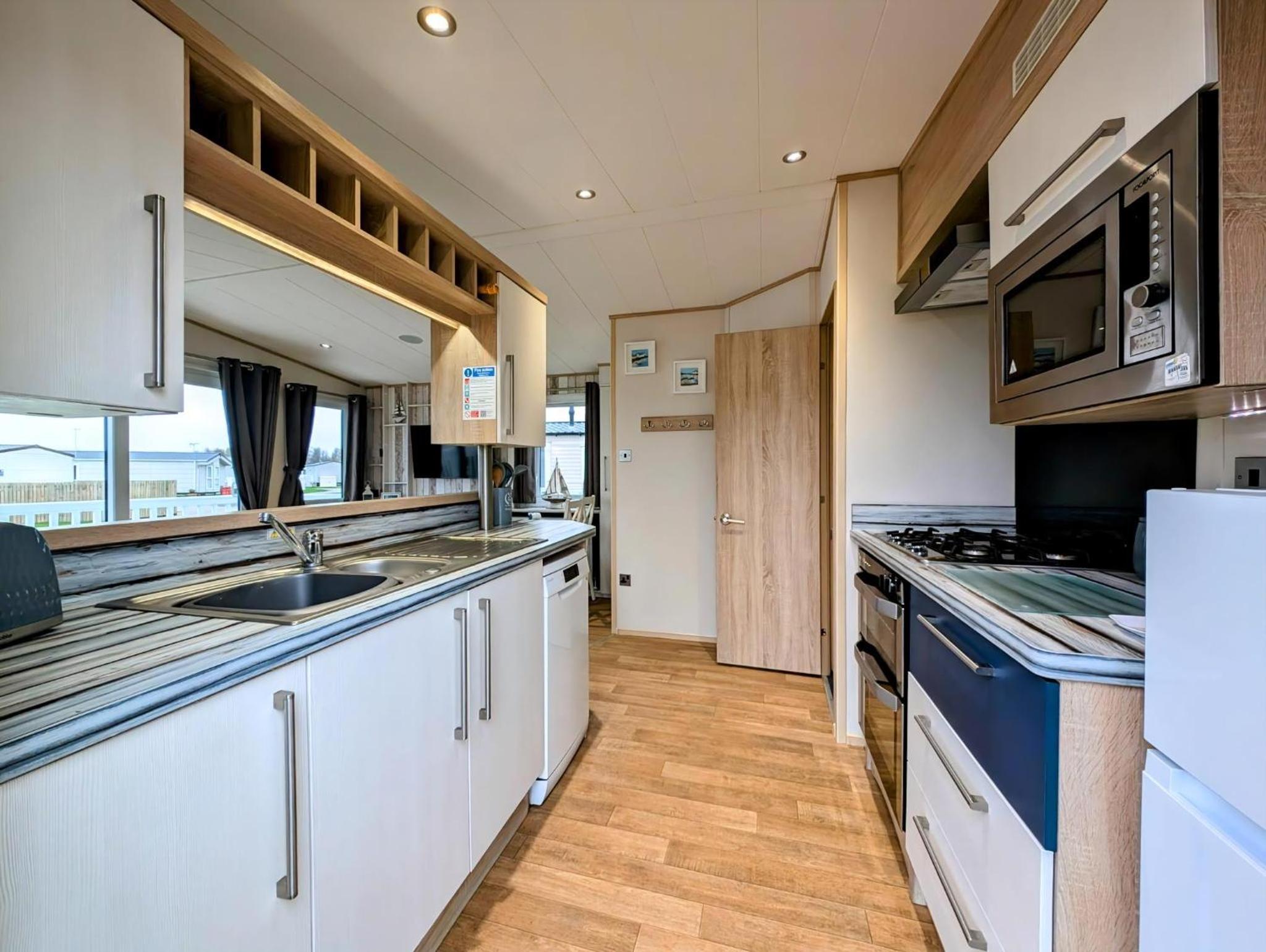 Beautiful 8 Berth Caravan With Decking At Hopton Holiday Village Ref 80016W view 4
