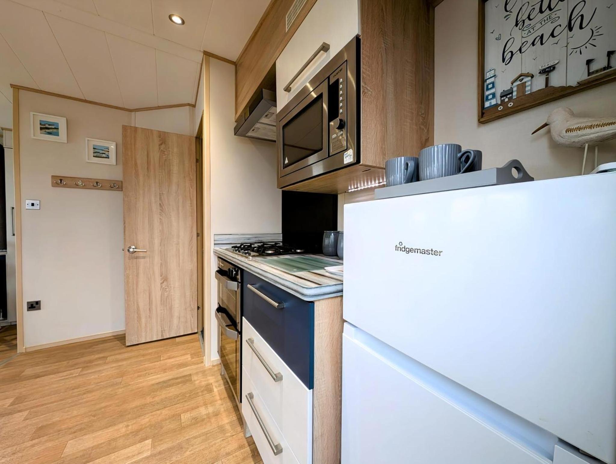 Beautiful 8 Berth Caravan With Decking At Hopton Holiday Village Ref 80016W view 5